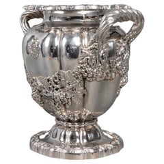 Antique Solid silver cooler in the “Medici” shape, the round scalloped base is decorated