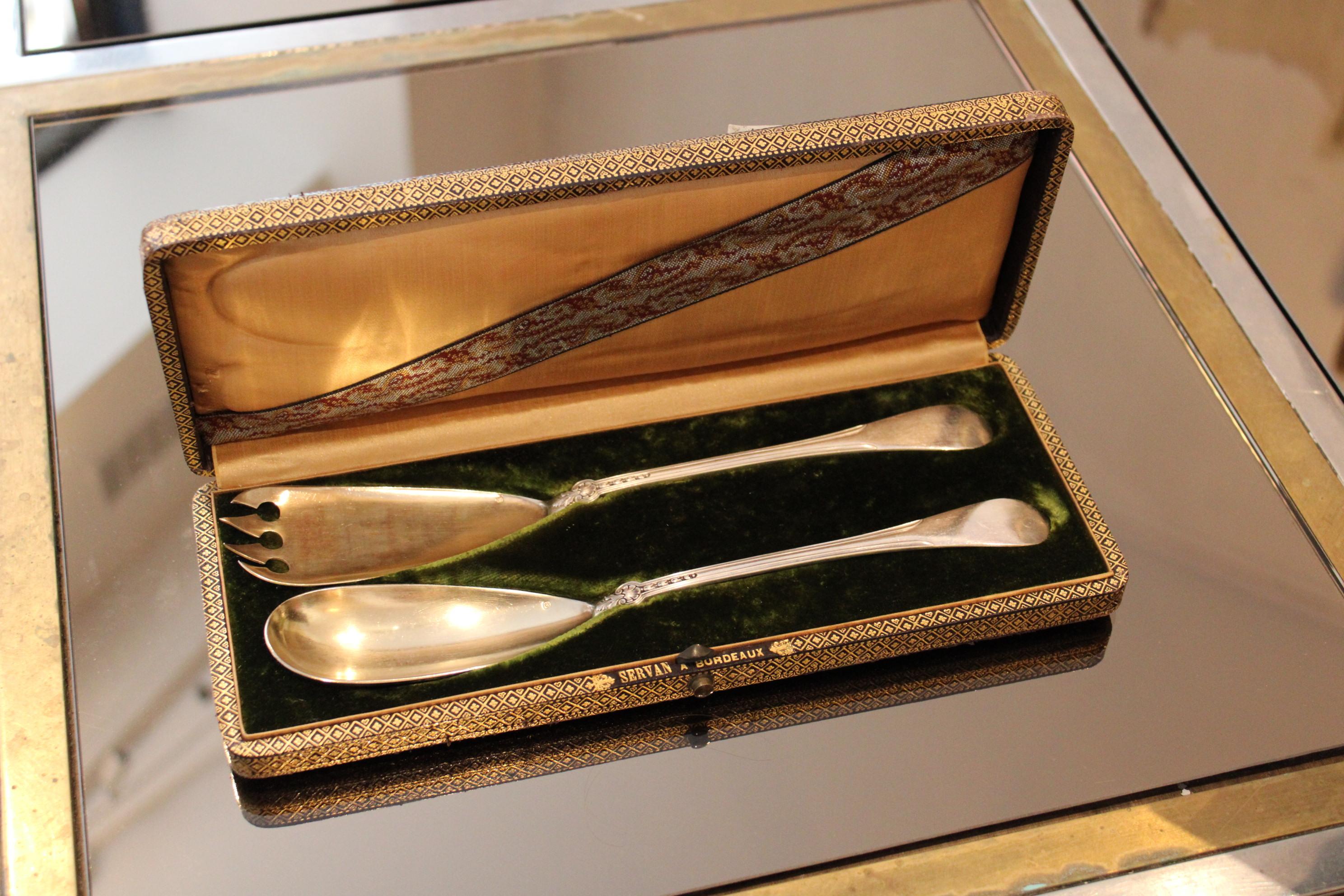 Solid silver cutlery in a box.

