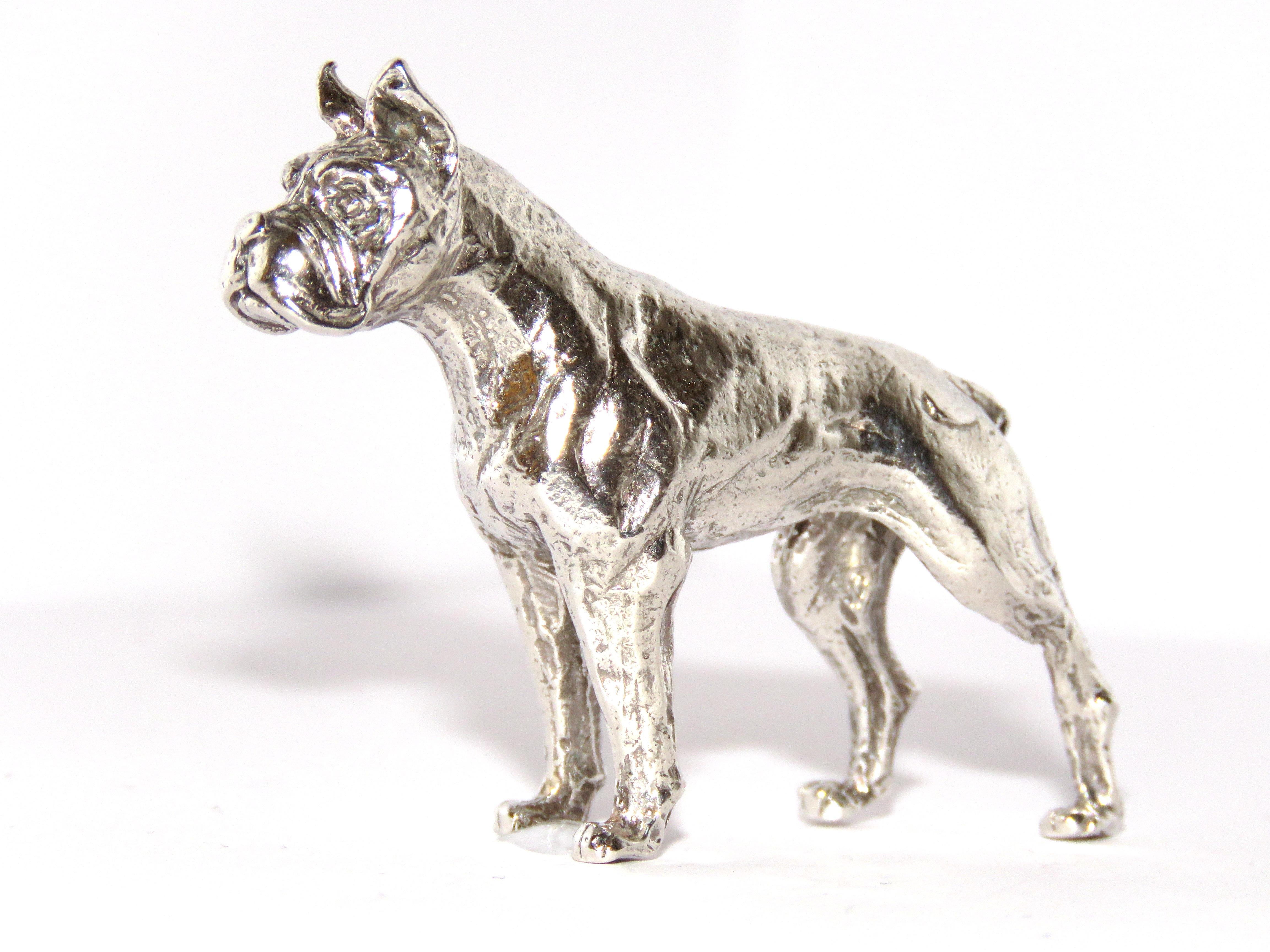 Solid silver boxer dog figurine, in very good vintage condition.
Dimensions: Height 45 mm / 1,77 inches - Length from tip of tail to tip of nose 65 mm / 2.55 inches - Weight 56 grams / 1.80 troy ounces
It  is stamped with the Silver Italian Mark 925