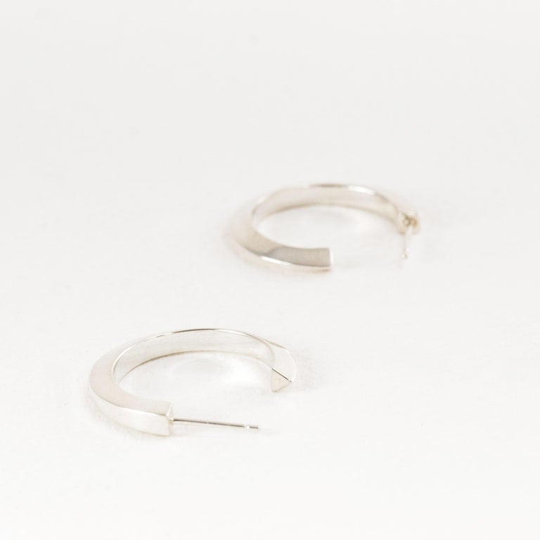 Solid silver hoop earrings medium flow square to triangle for sale at