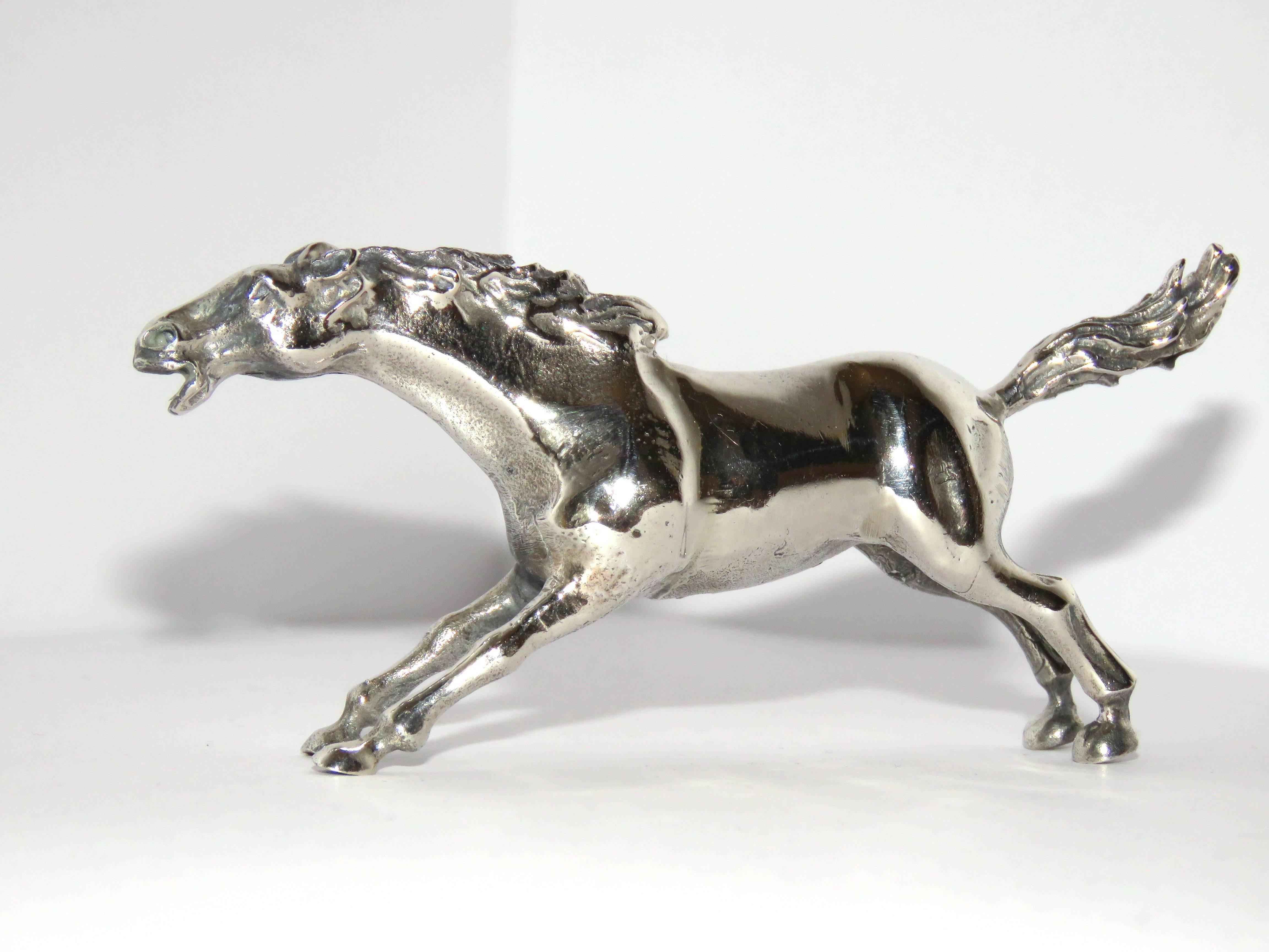 Solid silver horse figurine, in very good vintage condition.
Dimensions: Height 45 mm / 1,77165 inches - Length from tip of tail to tip of nose 105 mm / 4,13386 inches - Width of body 20 mm / 0,787402 inches - Weight 93 grams / 2.99 troy ounces
It 