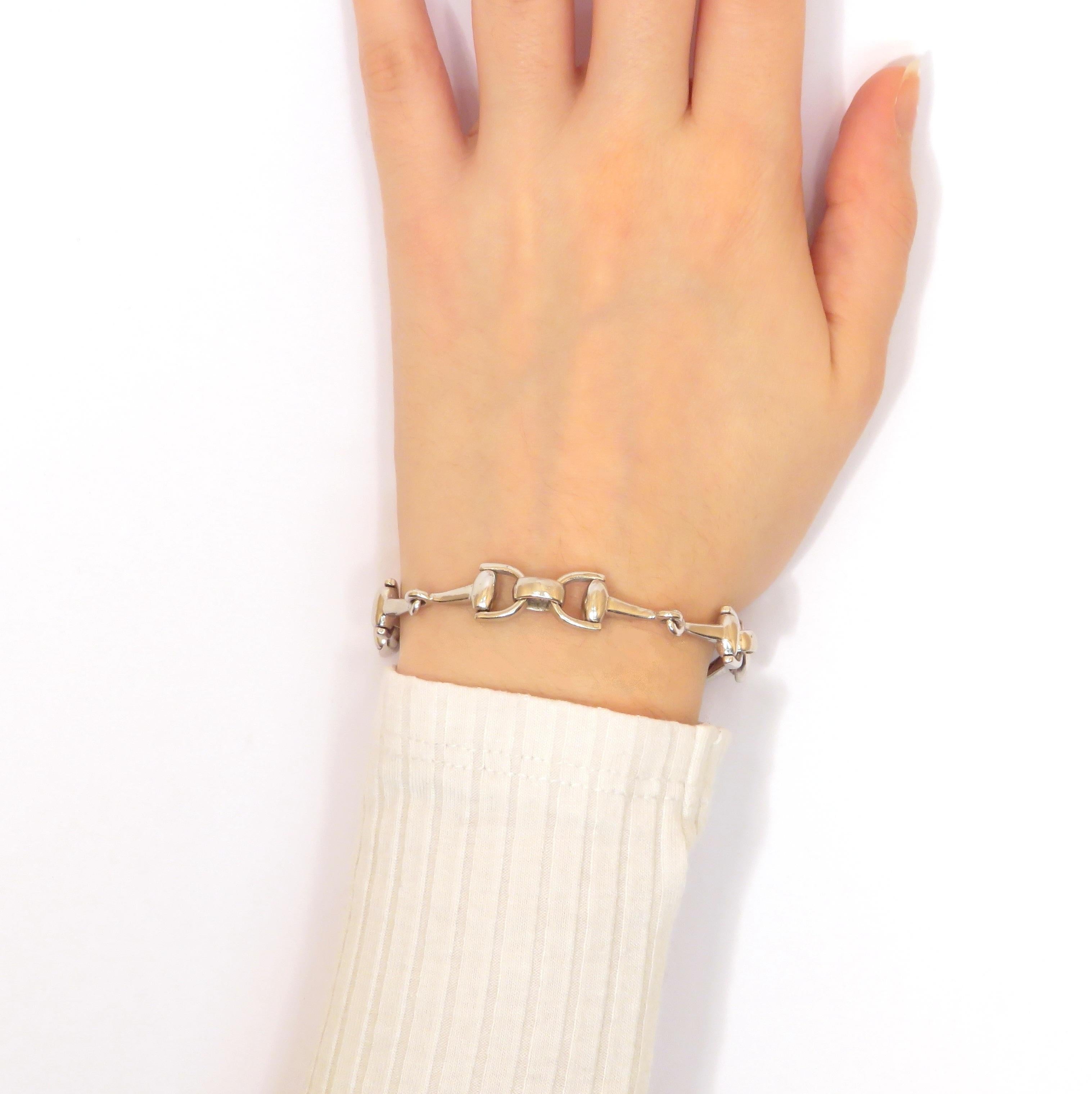 This very nice bracelet is crafted in solid silver 800 and features a repeated pattern of horse stirrups. It has a hidden hook clasp. The total length is 185 mm / 7.283 inches. It is marked with the Italian silver mark 800.

Crafted in: solid silver