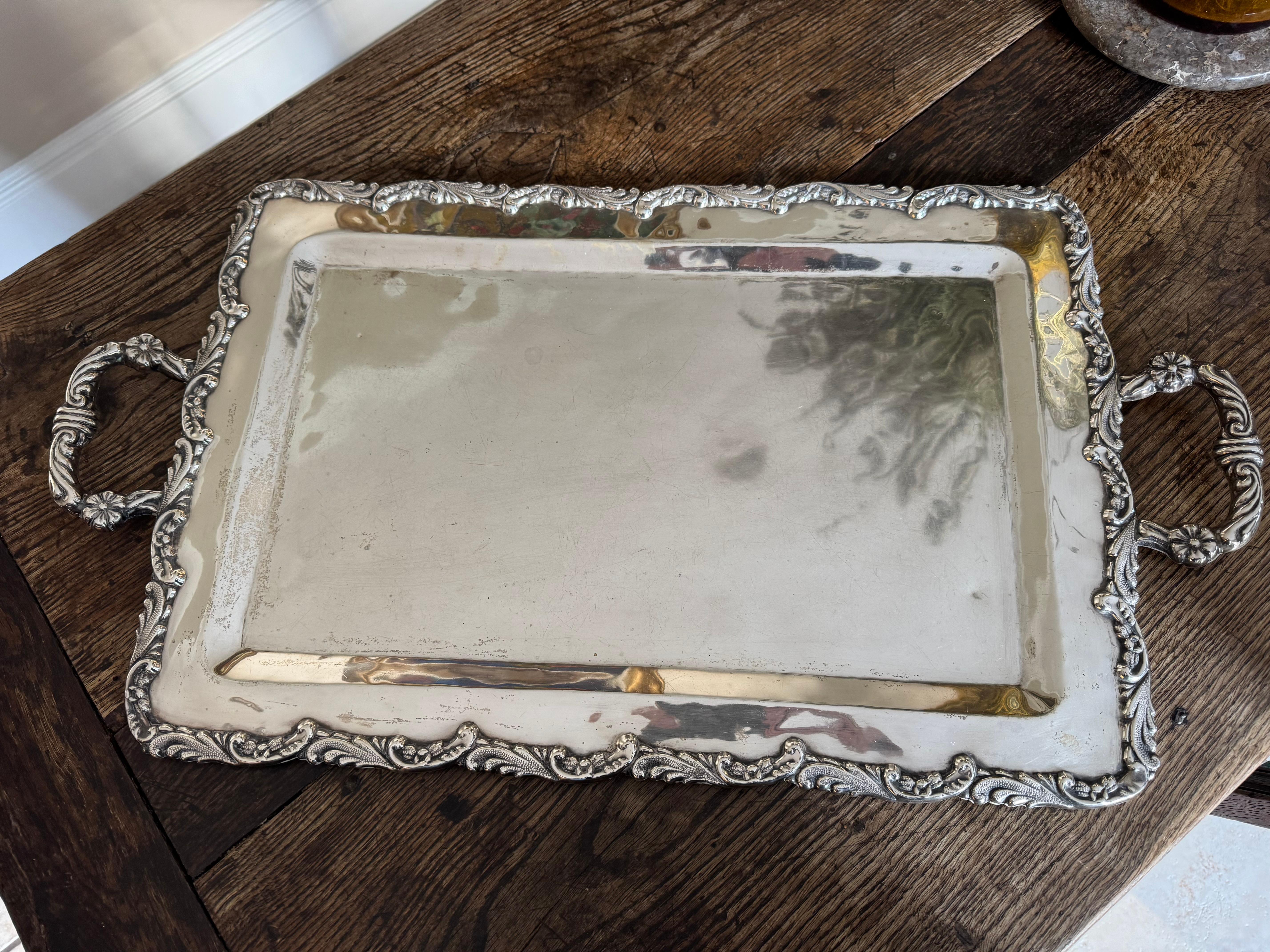 A fabulous large solid silver handled tray made from 900 Peruvian silver. Beautifully crafted. Total weight 2010 grams. Minor dents but otherwise in strong original condition. 
