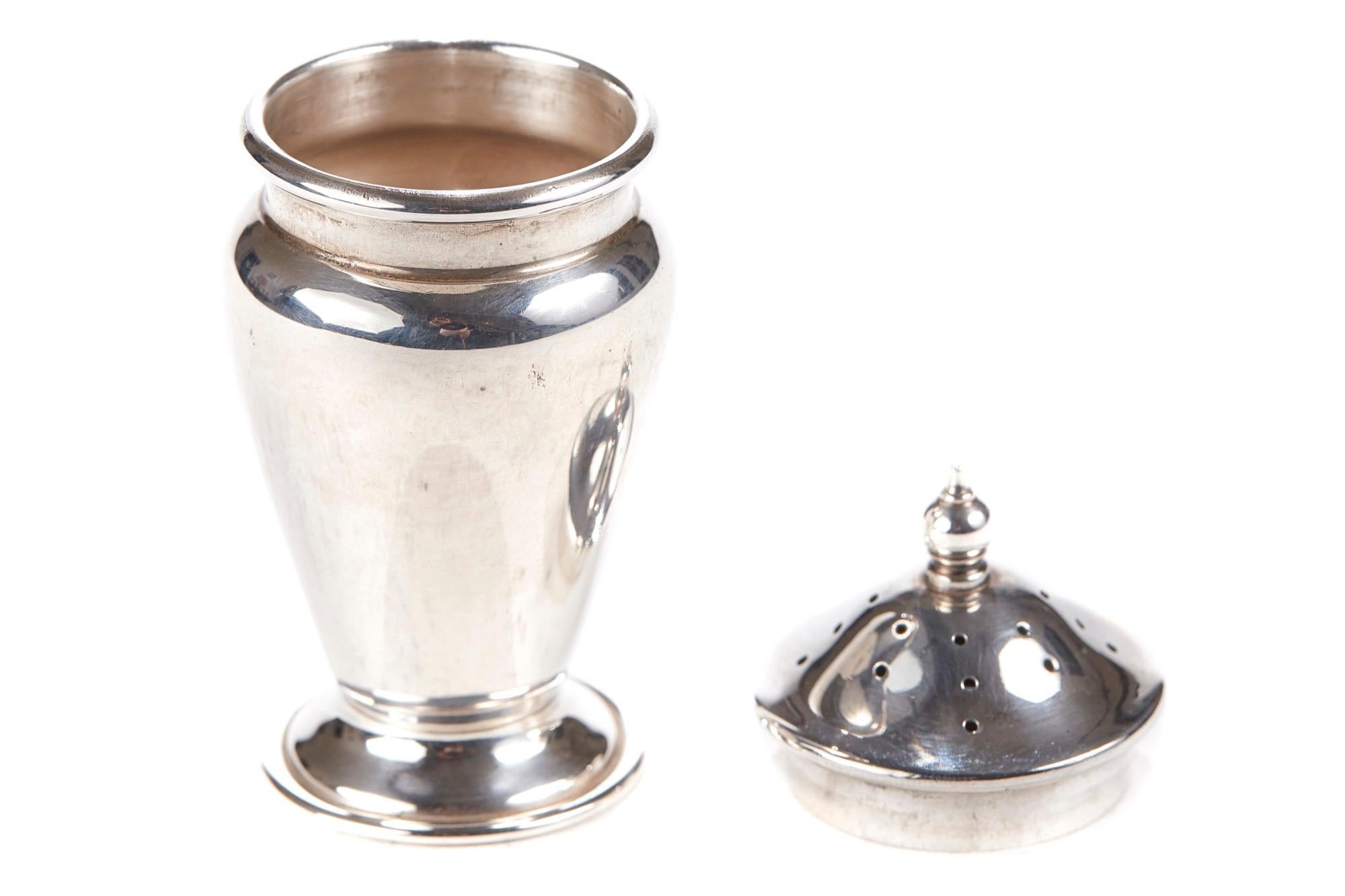 Offered for sale is this solid silver pepperette with lift off lid. Lovely shaped item. It is in perfect condition.