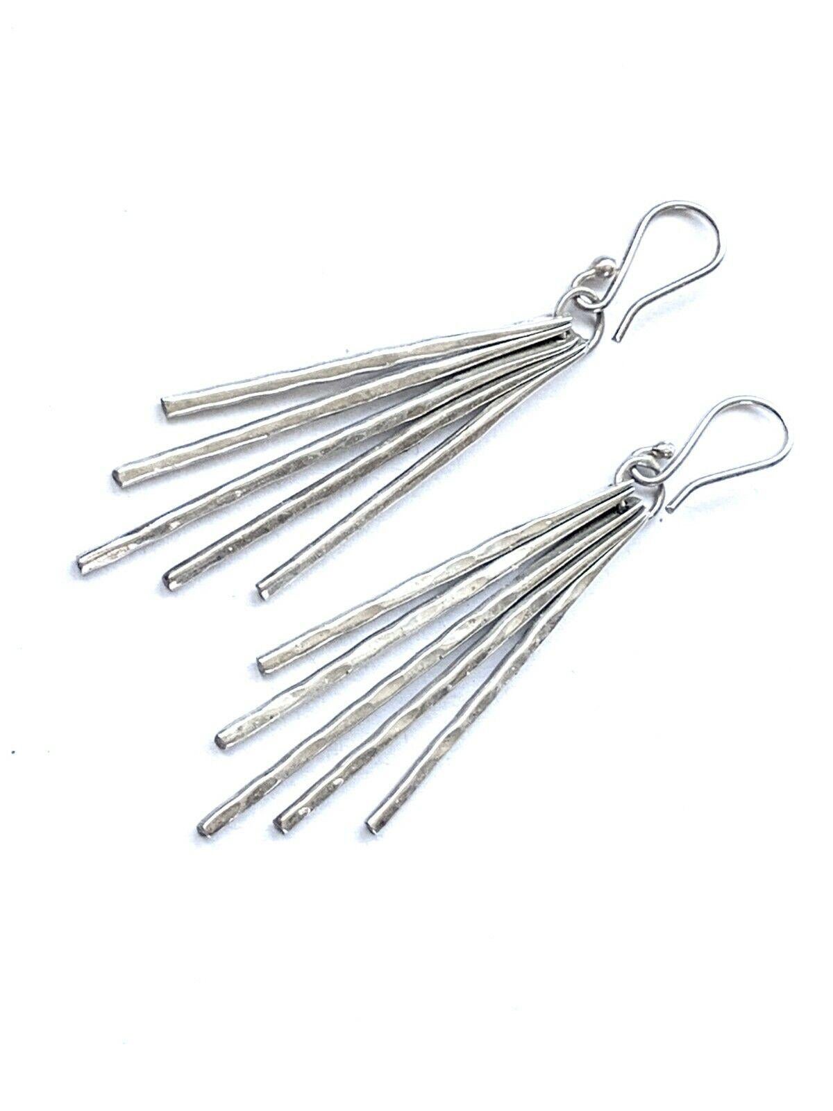 Beautiful dangling - each piece moves freely
Handmade artisan earrings
each section is solid silver and one is stamped 925
with original Shepard hooks
Large but not too heavy - quite comfortable .
Chic artisan appeal
with a beautiful smooth high