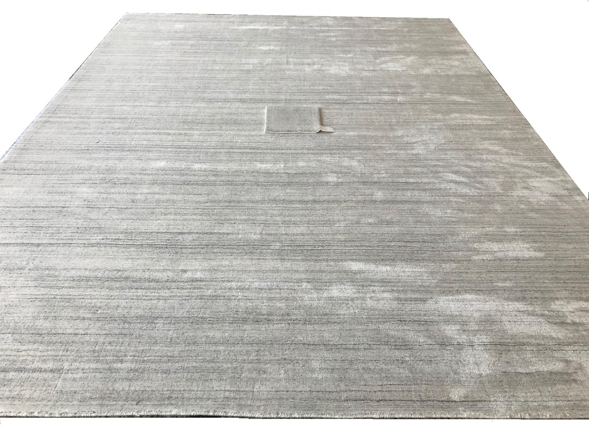 Industrial Modern Minimalist White Bamboo Silk Hand-Loomed Solid Rug with Silver Tone For Sale
