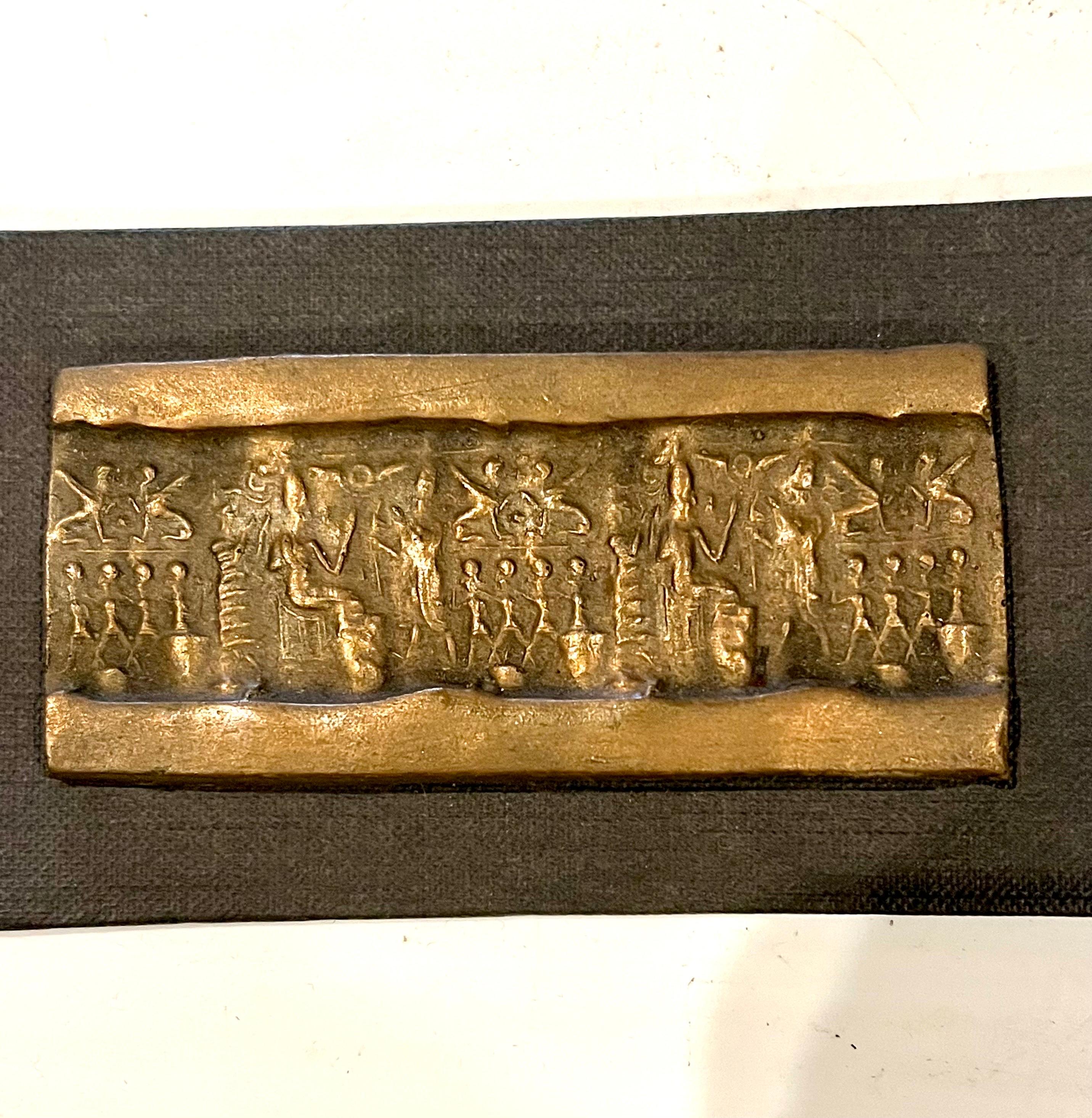 Beautiful rare bronze sculpture seal mounted on black cardboard new and never used, late Canaanite period 13th century BCE. Hazor the bronze plaque its 4' x 1.75