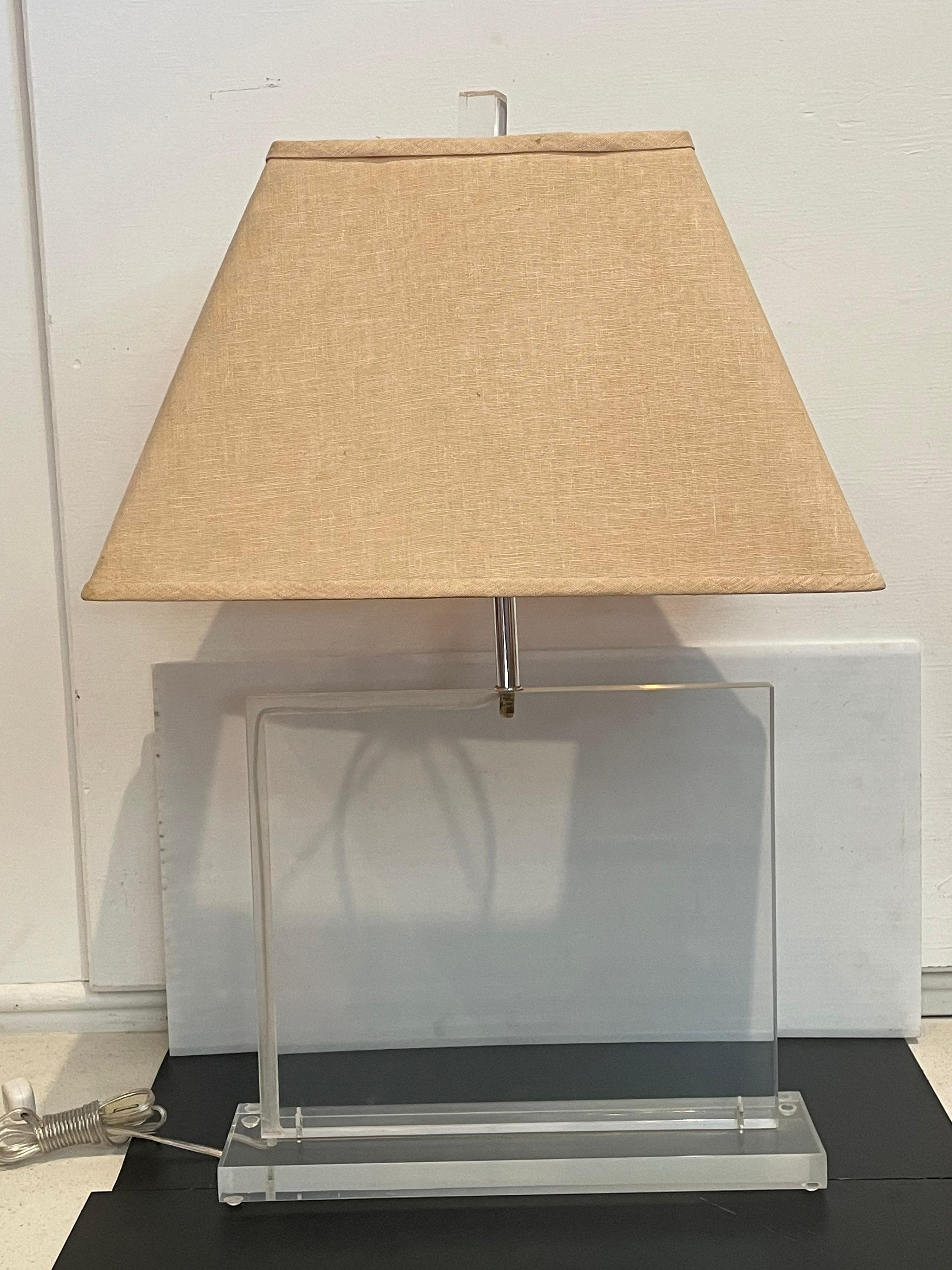 1960s solid square Lucite lamp with finial Lucite top, the lampshade it’s not included not in good condition. We polished and rewired the lamp it’s a simple elegant design. Shows some fogging due to age the cord its hidden on the edge, circa 1960s.