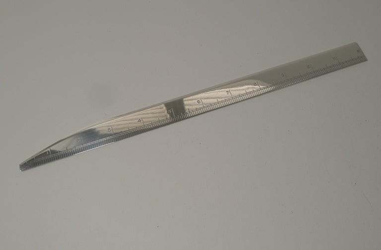 A wonderful find, this magnificent combined ruler and letter opener is made from a good gauge piece of English sterling silver weighing 80.5 Grams / 2.58 Troy Ounces.

Made by the top-notch London silversmith / luxury retailer, Asprey of Bond