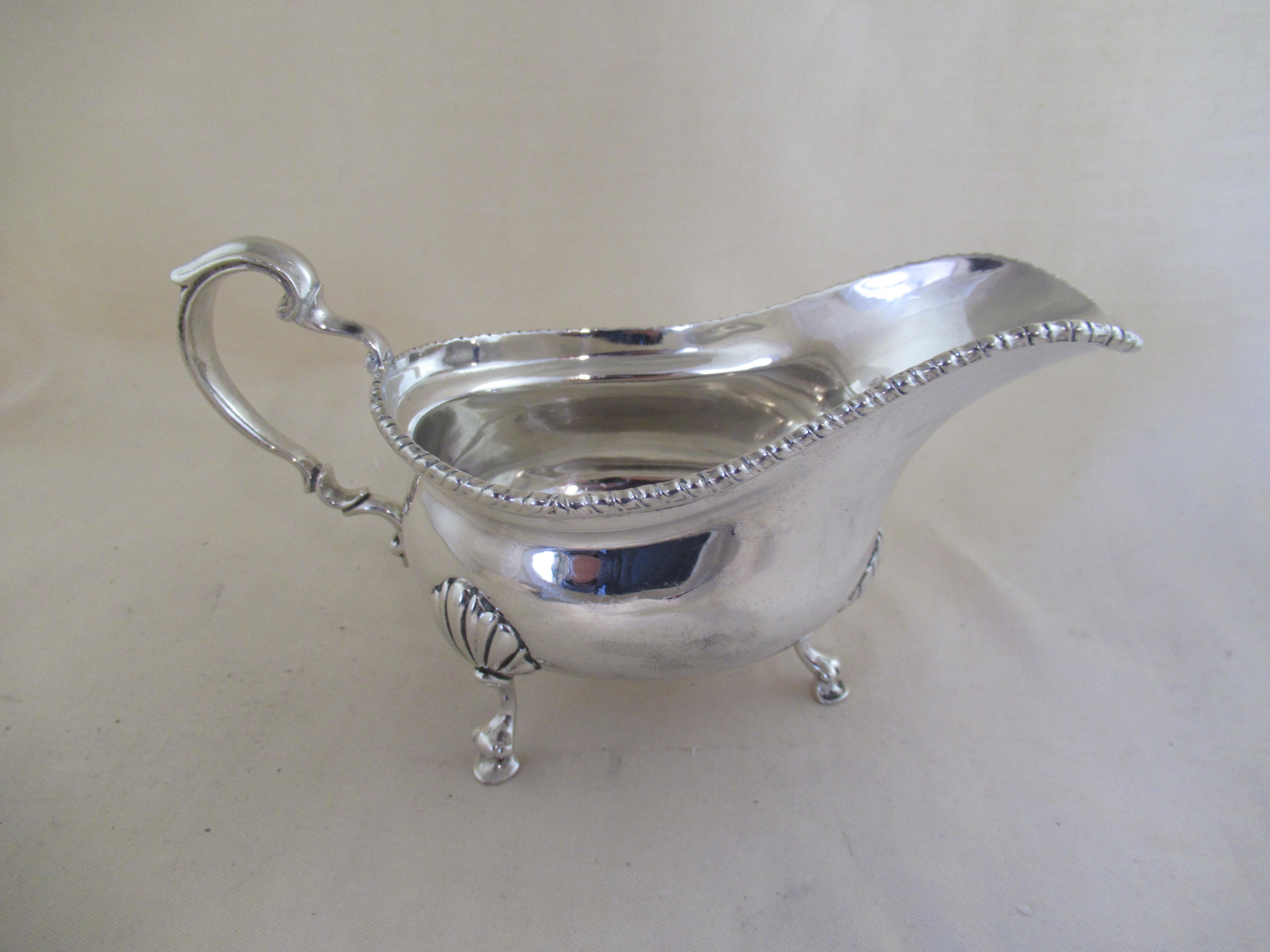 English Solid Sterling Silver SAUCE BOAT / CREAM JUG
Full set of English hallmarks applied by the London Assay Office, showing that it was made in London 1928.
 Lion - Sterling guarantee
 Leopard`s Head - London Assay Office
 n - Date letter for