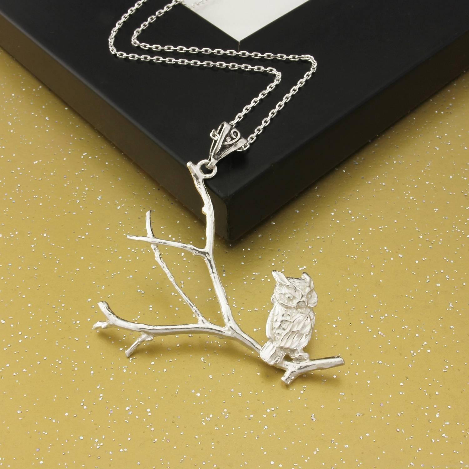 This delicate, feminine Owl on branches necklace, made from solid Sterling Silver, will delight the discerning, artistic owl lover.
The positioning of the owl and the delicate silver branches lend this 3 dimensional pendant a cachet of its own.
The
