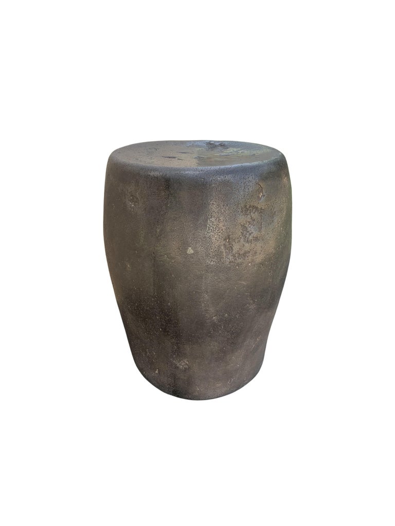 A incredibly heavy and solid rounded stone block. This lovely sculptural object was crafted from a solid stone slab. A raw and organic object with beautiful textures. Sourced from a river bed in East Java, it was carefully shaped and polished into