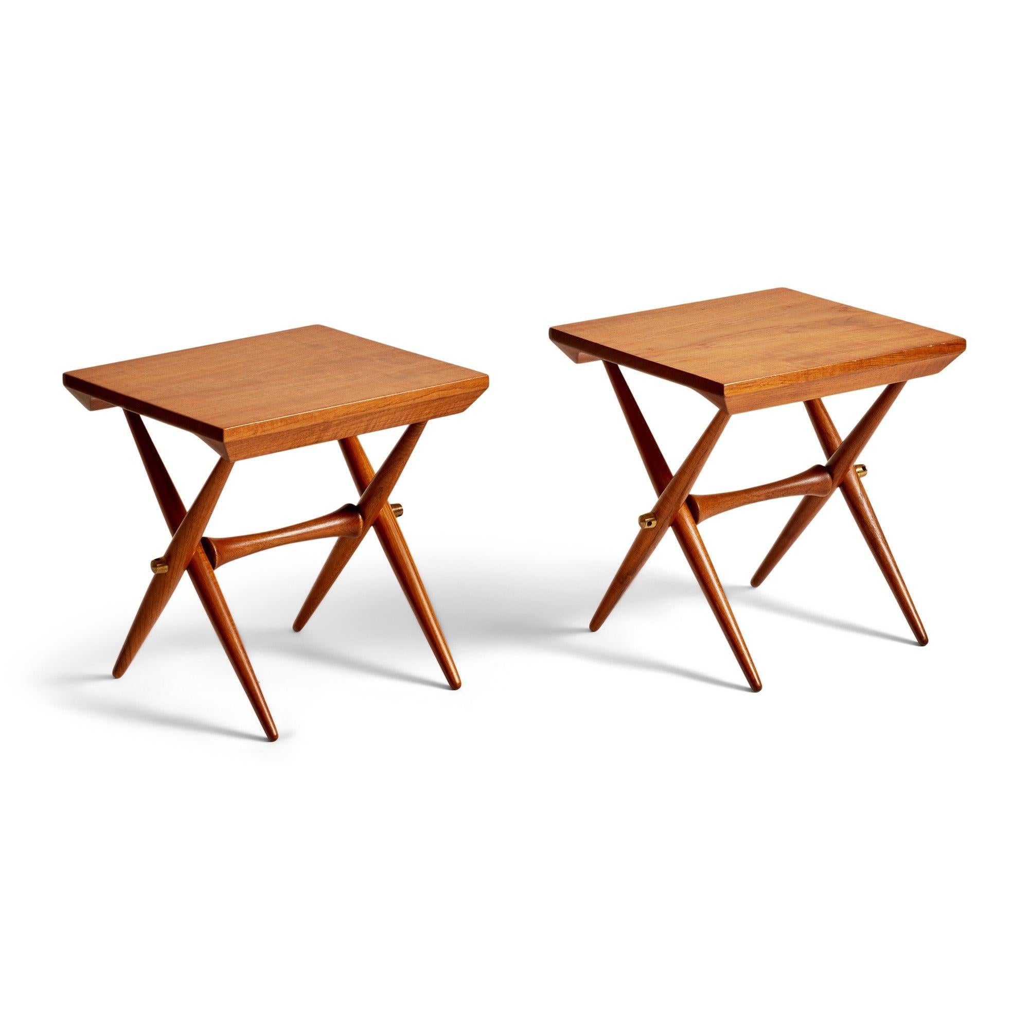A rare solid teak demountable occasional table with swollen dowel x-form legs, brass hardware. Priced per table.