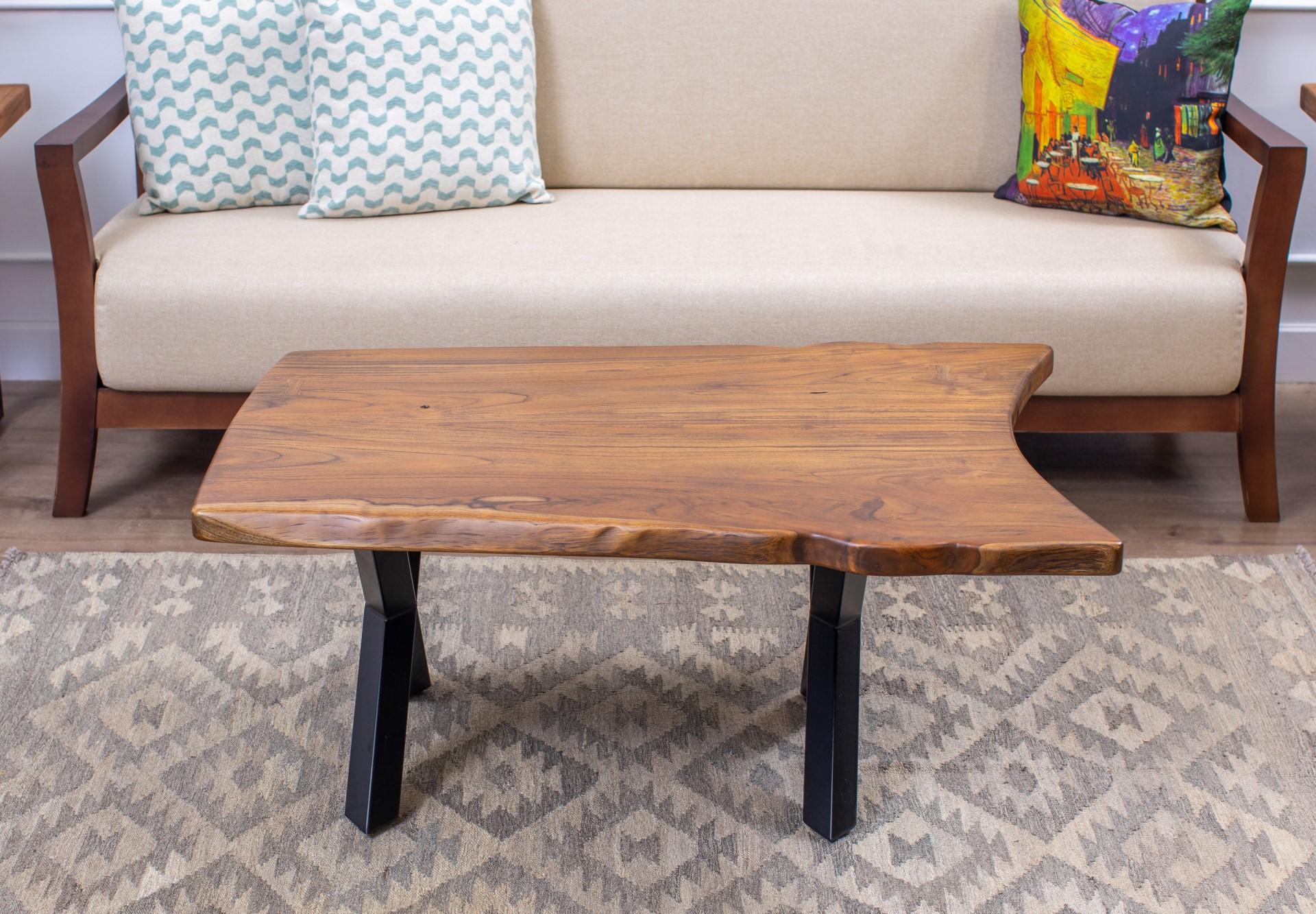 A beautiful, exotic, and sustainable rainforest hardwood, the golden Teak used in this one-of-a-kind piece will provide years of beauty and durability.

This unique coffee table is hand built using only two slabs of teak with a book-matching