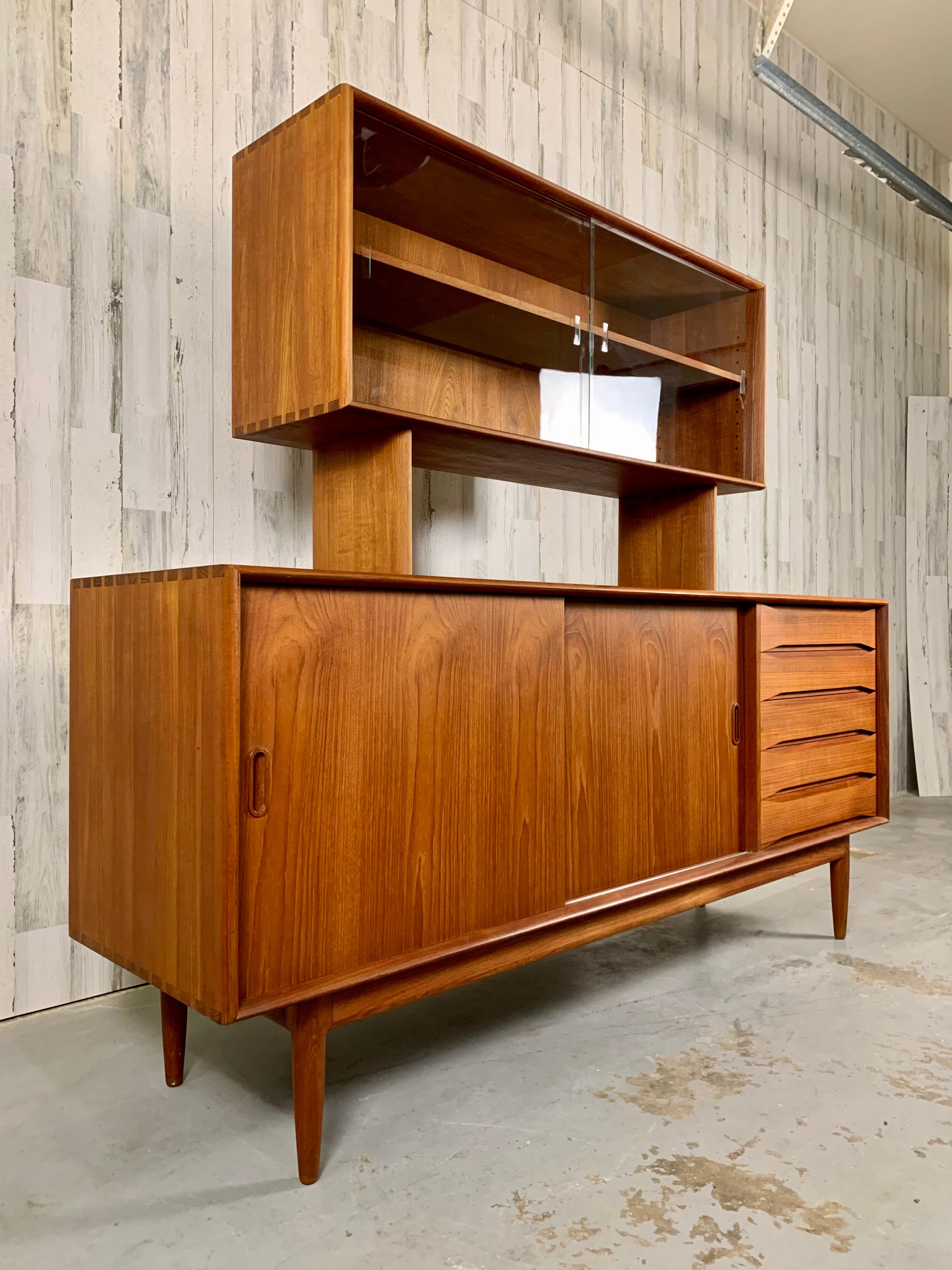 Danish modern solid teak credenza with hutch by Johannes Aasbjerg with dovetailed corners on the case and drawers
Also two sliding doors that have adjustable shelves inside. The back of the cabinet is finished so it can be floated in a room. Please