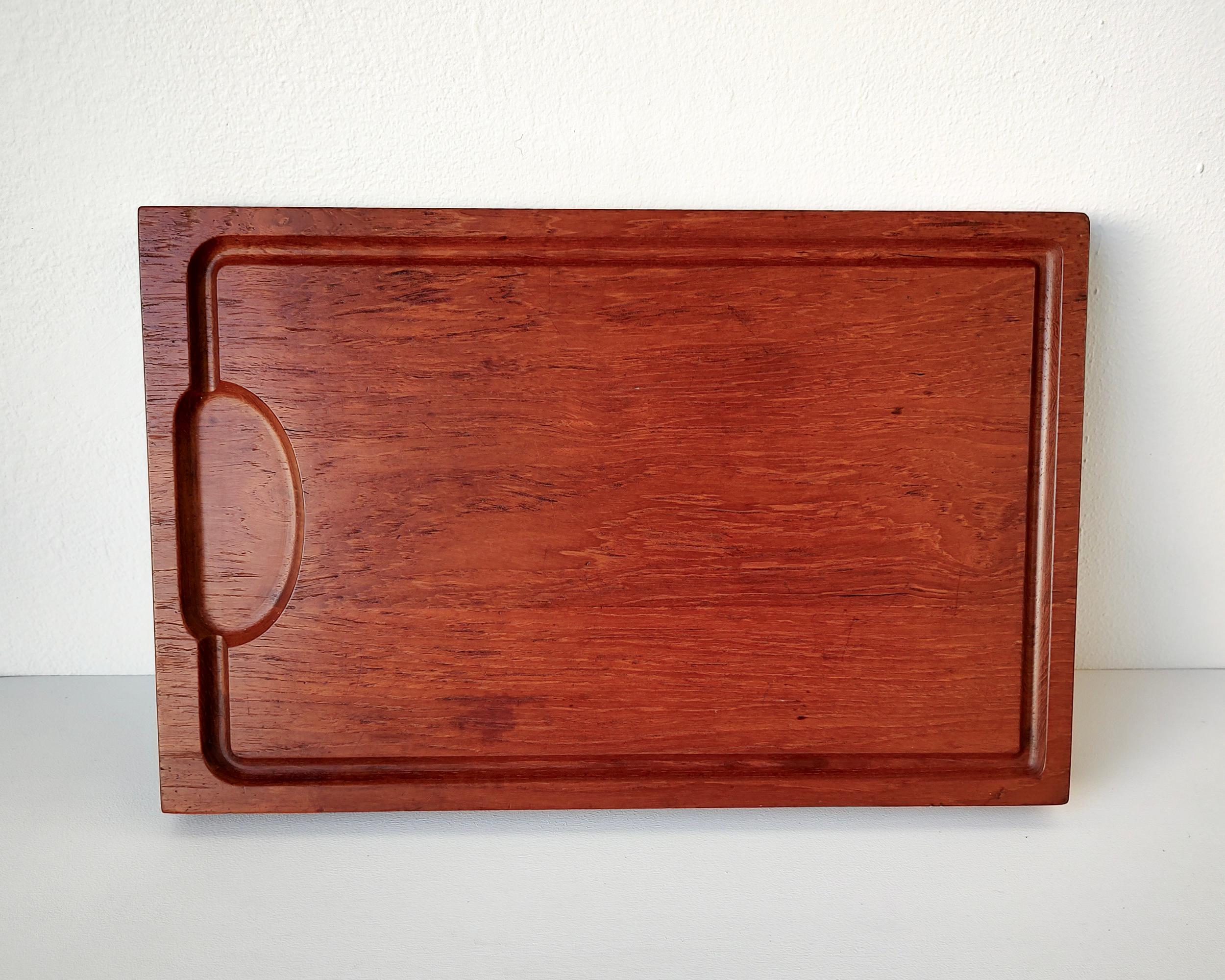 Beautiful vintage solid teak cutting board with carved channel for catching liquids. The surface has been lightly sanded and conditioned with food-safe oil.