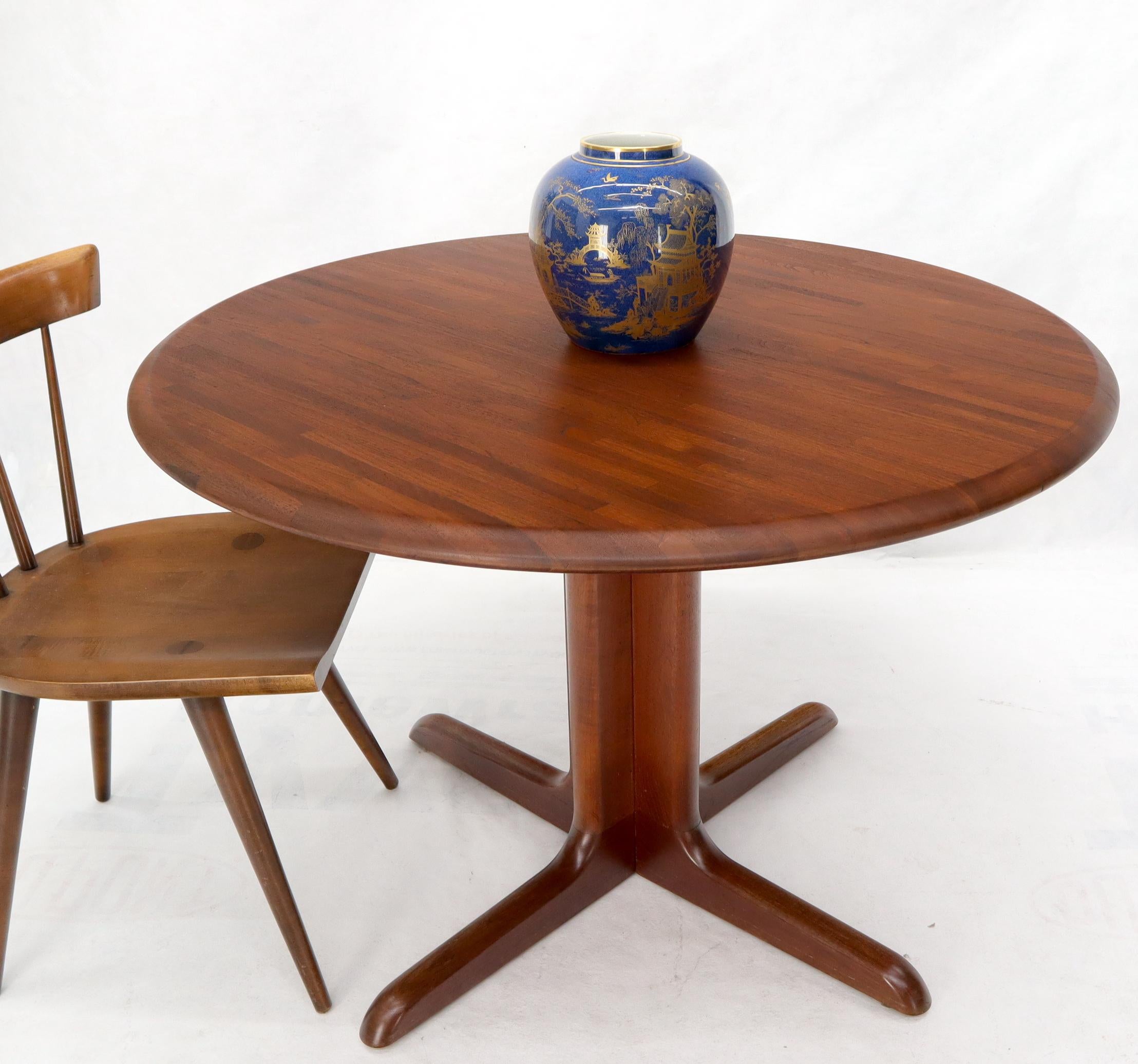 Danish Mid-Century Modern round solid teak dining table.