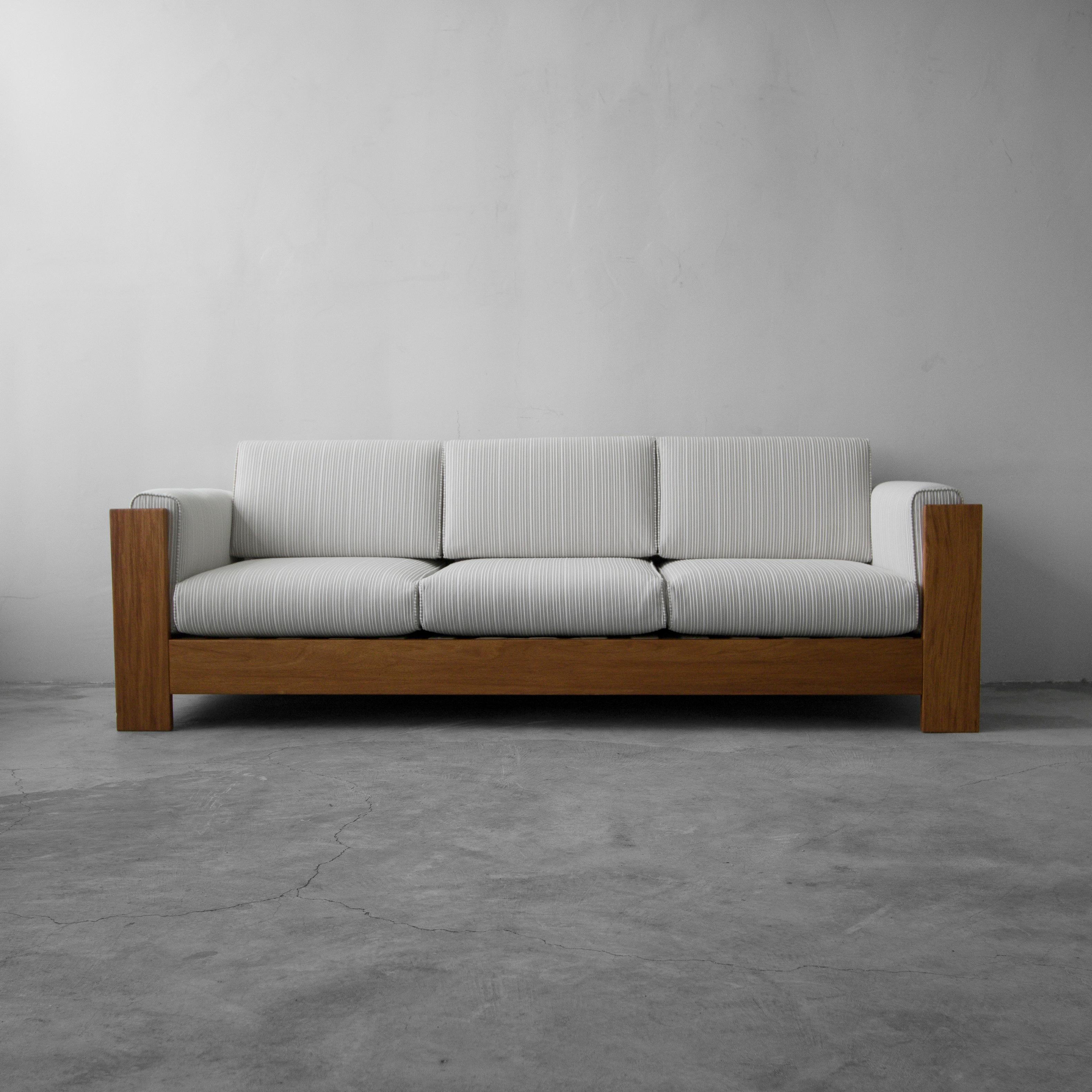 This is the classically perfect, solid teak, Danish sofa. This is a beautifully and solidly designed sofa with a slat back. This sofa is quite substantial and weighty in construction but maintains simple, clean design that will slide seamlessly into