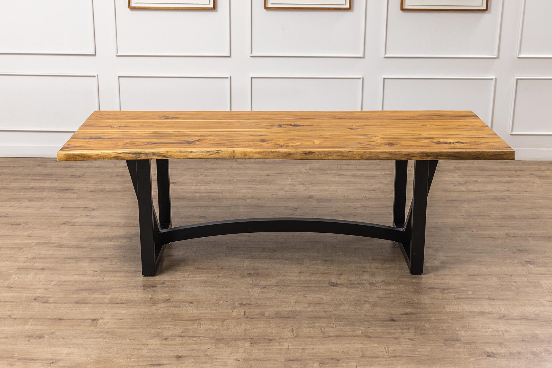 This gorgeous solid teak handcrafted table is built with 4 pieces of teak - 2 sets of book-matched planks. Expertly crafted with the care and quality you expect for the centerpiece of family memories, this table features a beautiful smooth natural