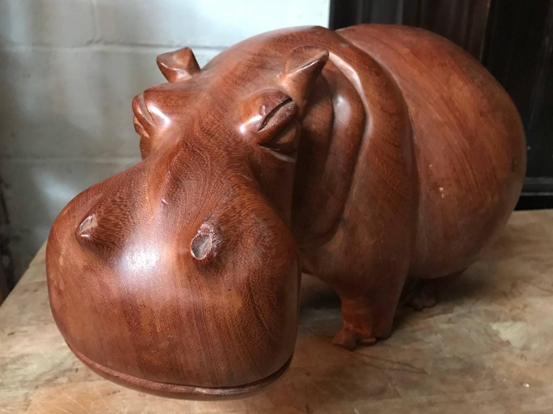 Solid teak hand carved hippopotamus sculpture.