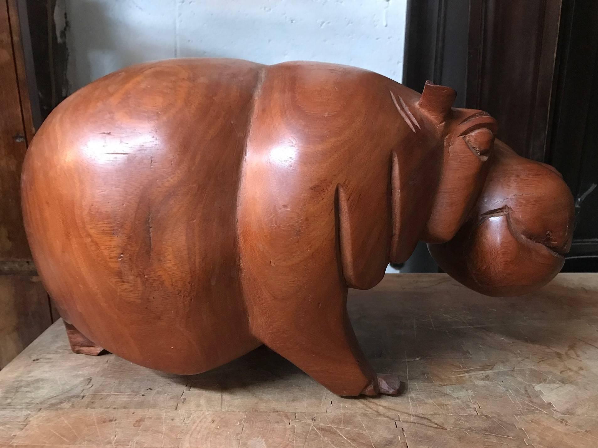 wooden hippo sculpture