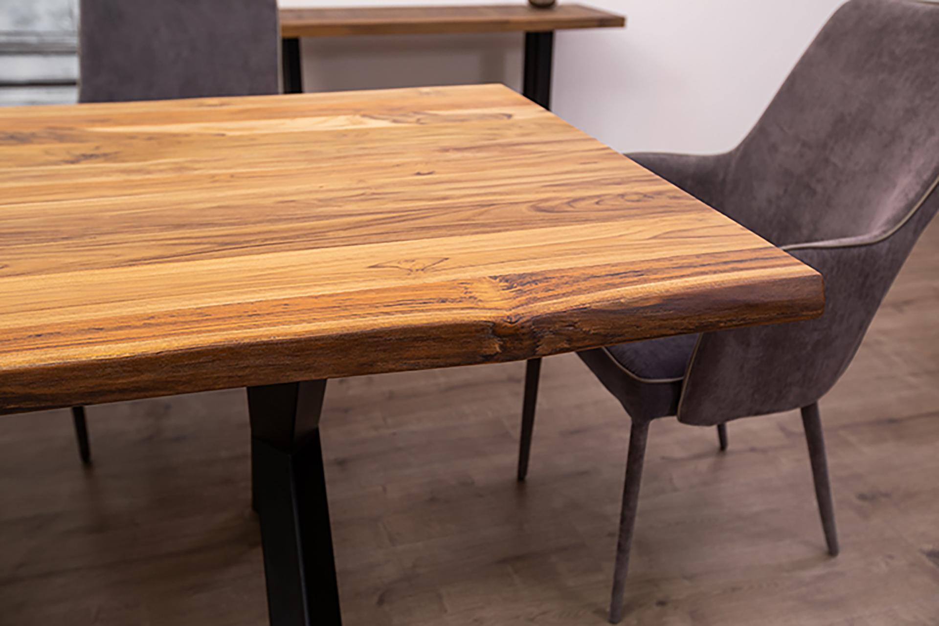 This hand-crafted, solid teak live edge dining table will make a stunning addition to any dining area with a combination of modern design and natural beauty. Breathtaking solid wood perfectly preserved in its most natural state makes this product