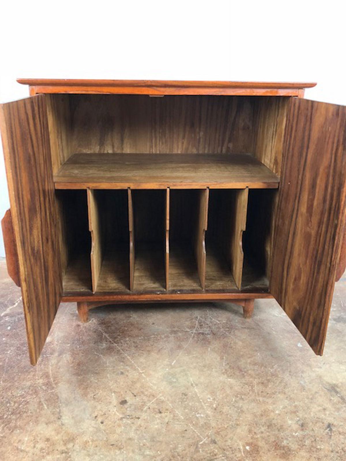 Mid-Century Modern record storage cabinet made with solid teak. No veneers, circa 1950s. Unknown maker. Original acquisition condition.