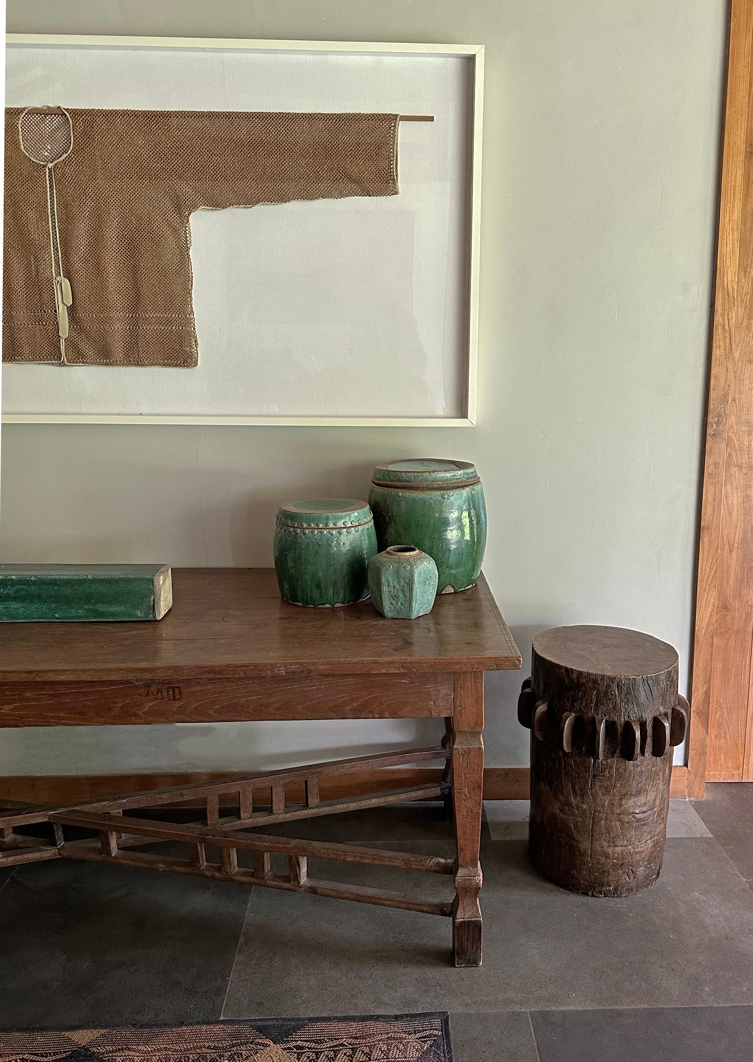 This solid crusher was part of a larger sugar cane press extracting the sugar rich juices from harvested sugar cane. Hand-carved from teak It has a smooth finish and would make for a wonderful pedestal, side table or as a sculptural object on