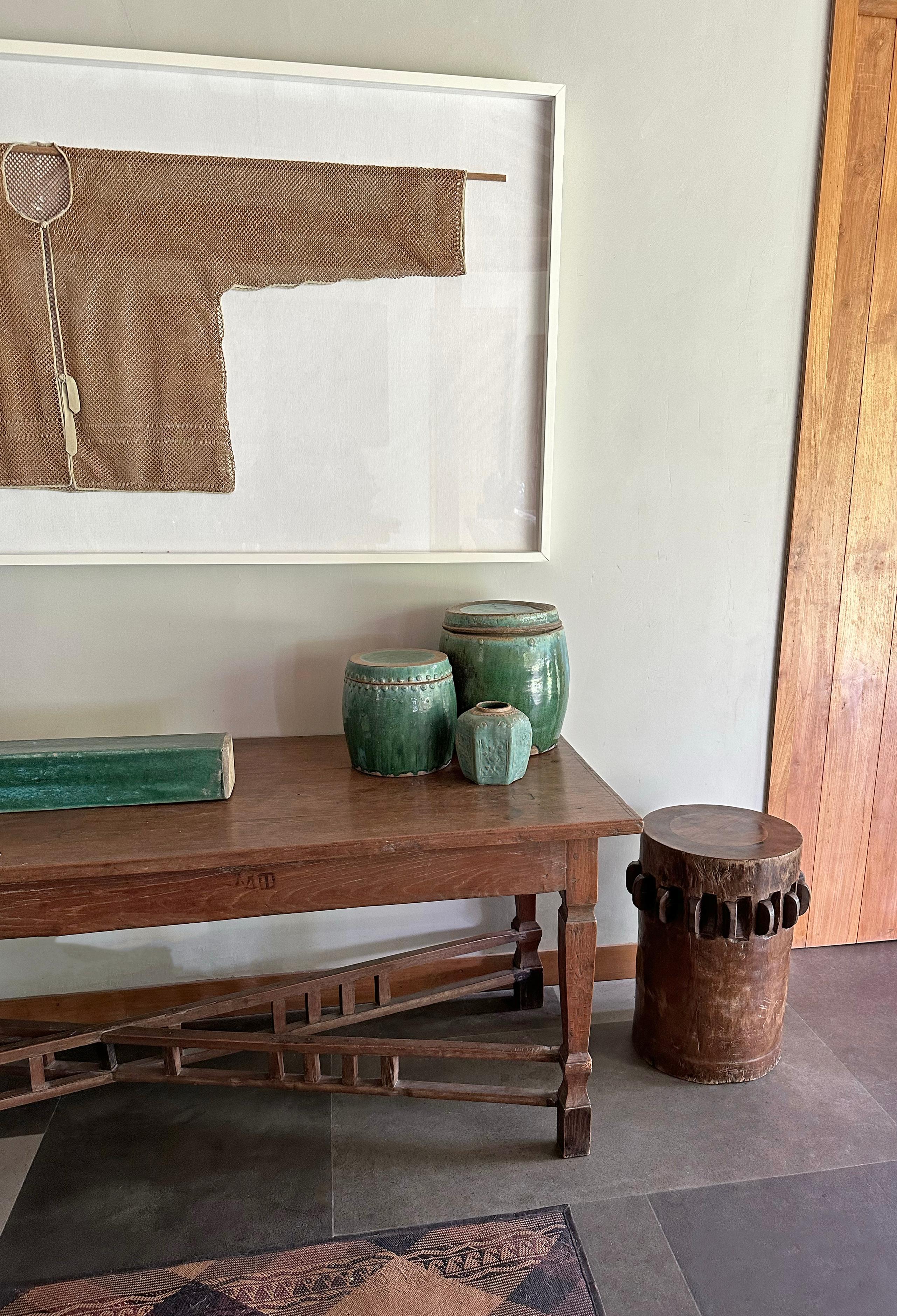This solid crusher was part of a larger sugar cane press extracting the sugar rich juices from harvested sugar cane. Hand-carved from teak It has a smooth finish and would make for a wonderful pedestal, side table or as a sculptural object on
