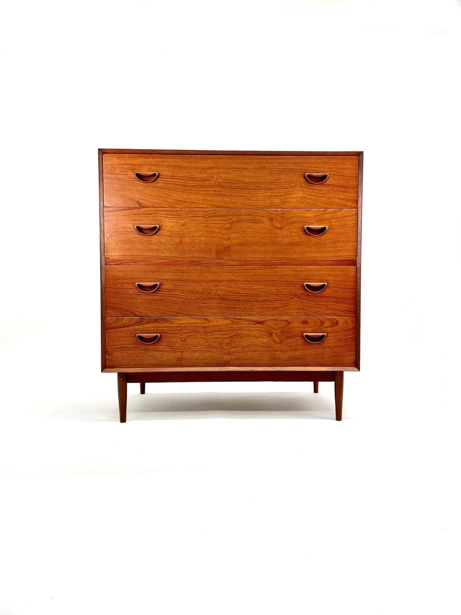 Solid Teak Vanity Dresser Chest designed by Peter Hvidt & Orla Mølgaard-Nielsen. It was produced in Denmark by Søborg Møbelfabrik during the 1950's.

This is a rare piece in that it is made of solid teak. The high-quality craftsmanship is notable in
