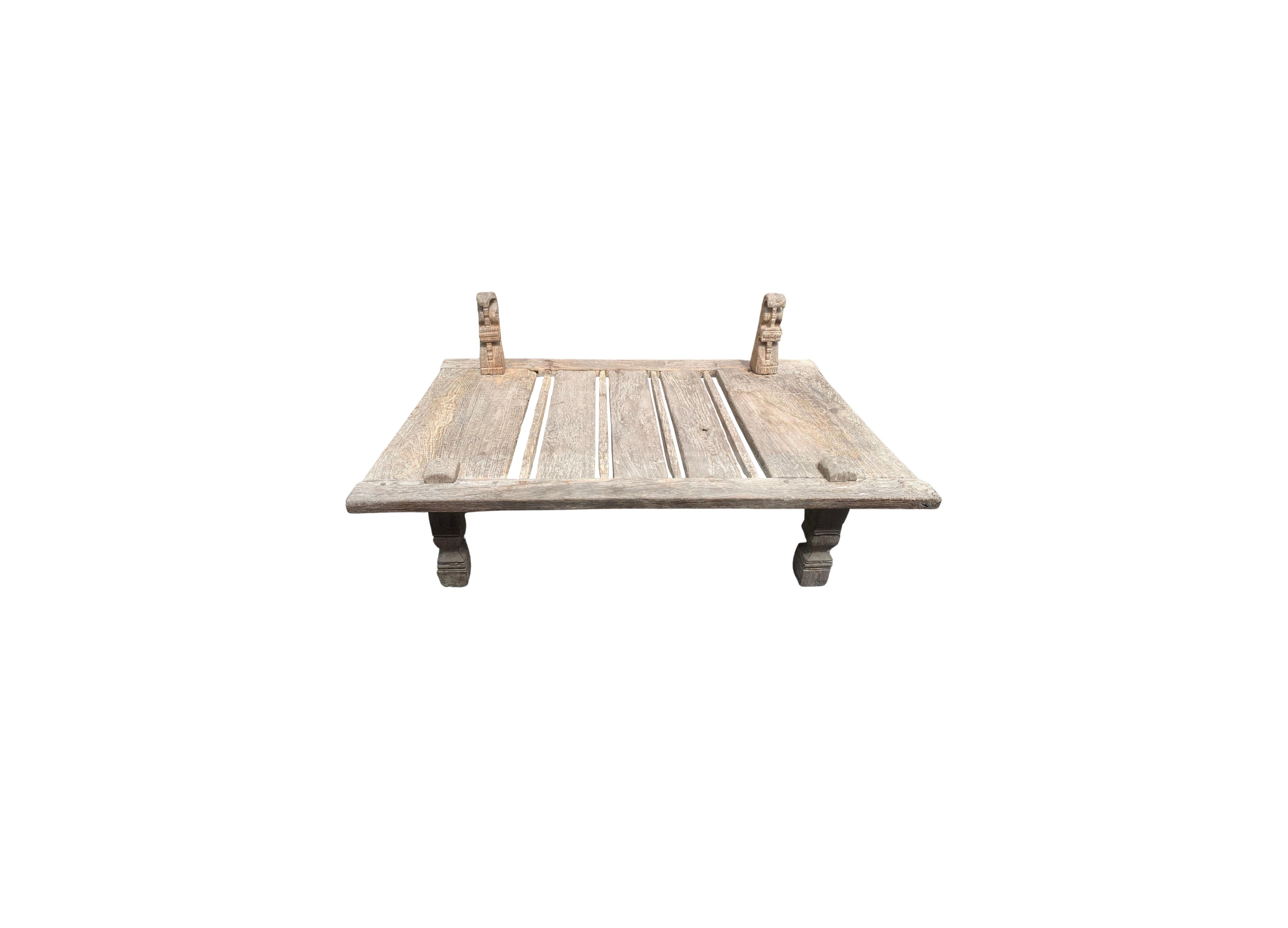 This solid teak weaving table was crafted in Java, Indonesia more than 100 years ago. It features extended columns on its top side which would have been used to hold horizontal weaving poles and help tighten fibres during the weaving process. An
