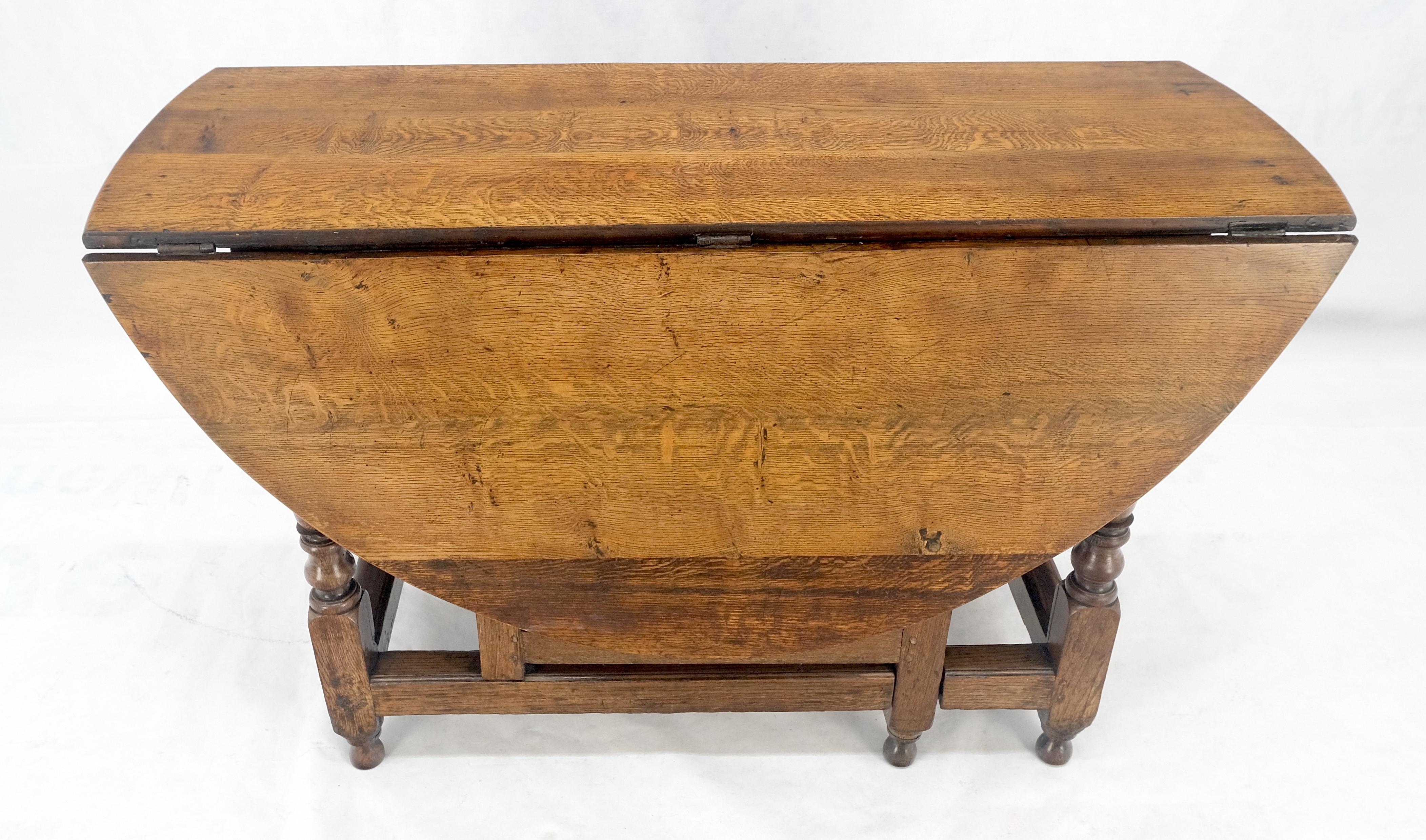 Mesa de Comedor con Pata de Portón de Hoja Abatible Ovalada de Roble Tigre Macizo ¡Limpia! siglo XX en venta