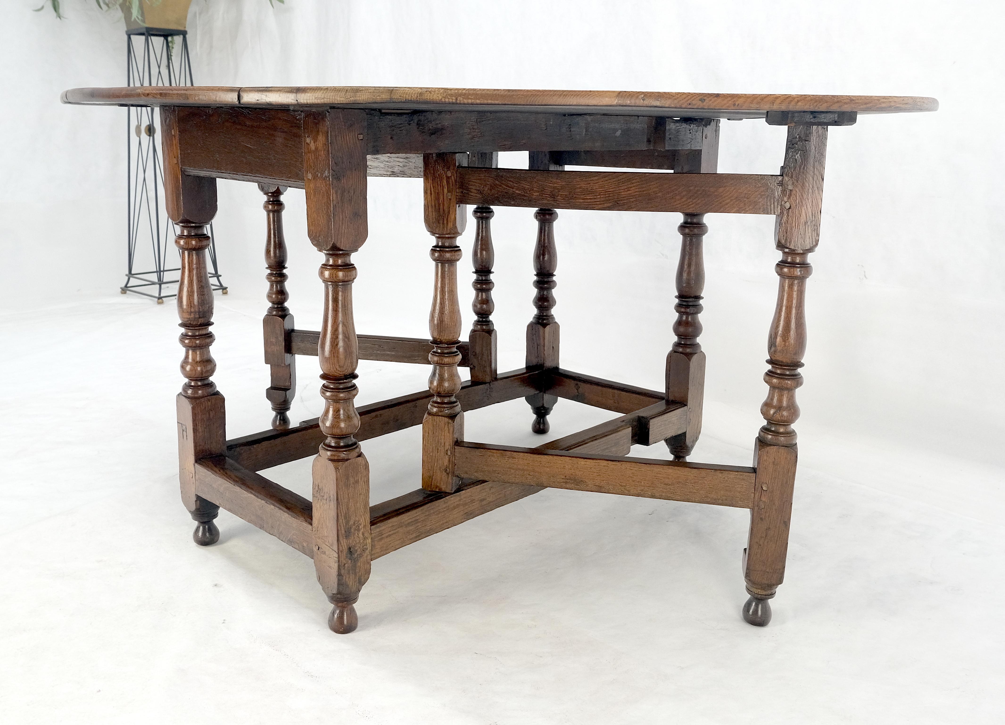 Mesa de Comedor con Pata de Portón de Hoja Abatible Ovalada de Roble Tigre Macizo ¡Limpia! en venta 1