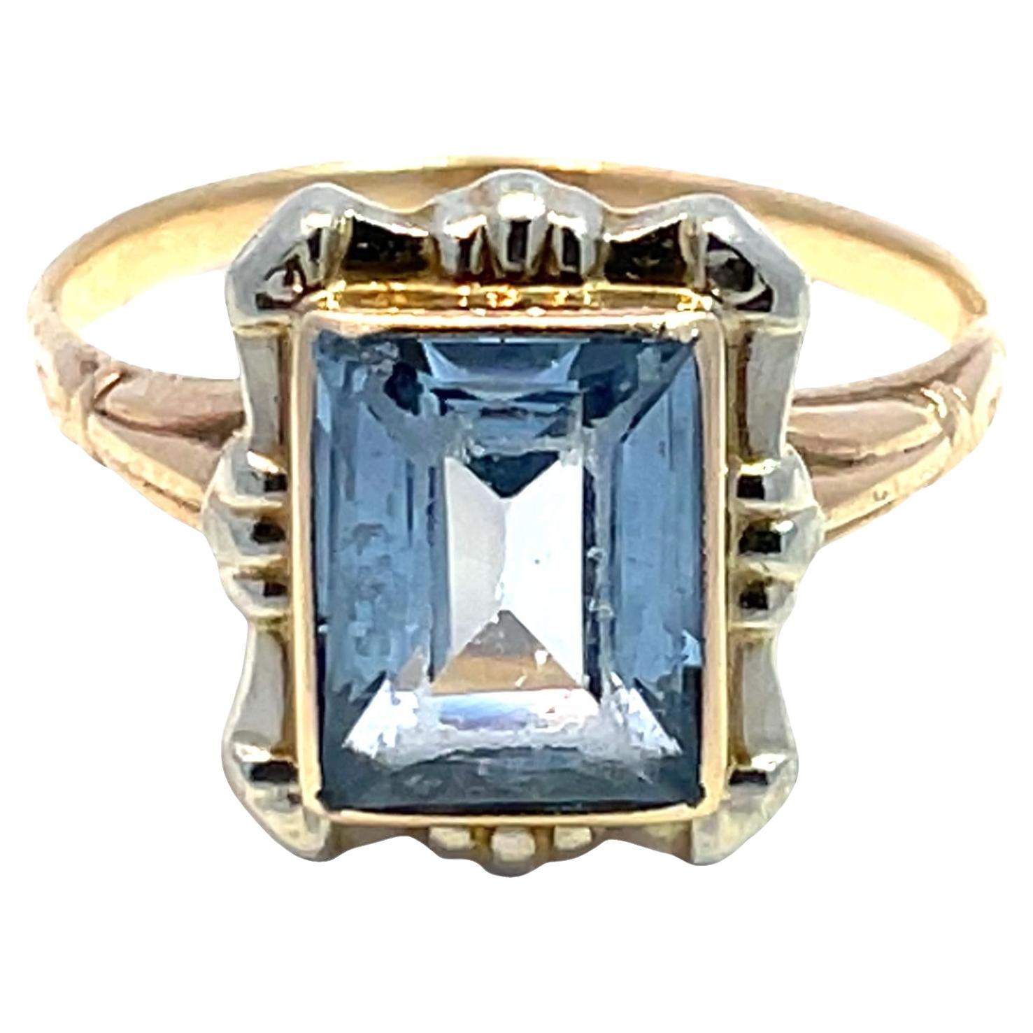 Solid Two-Tone Gold Emerald-Cut Blue Topaz Ring For Sale