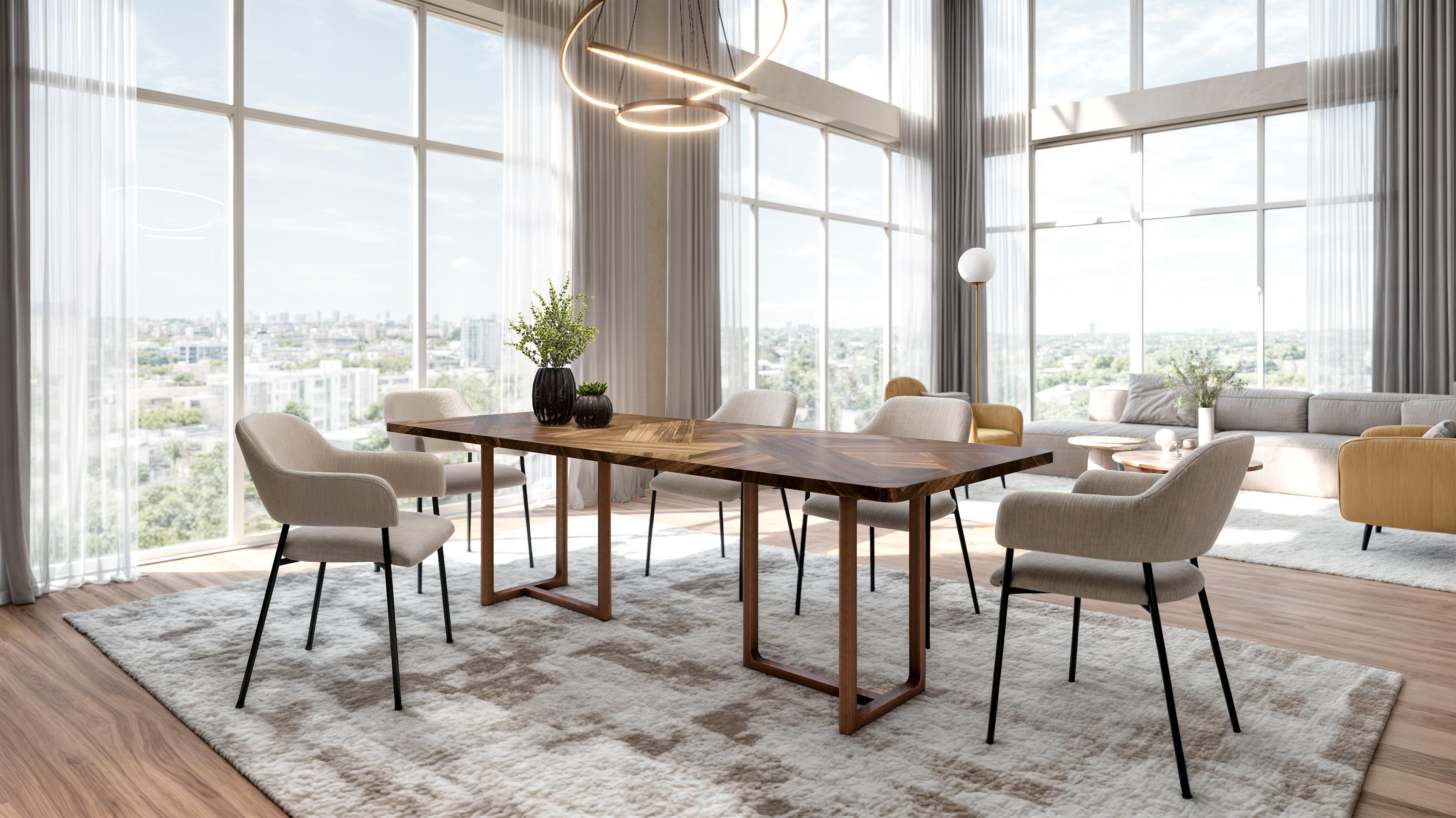 Cette table de salle à manger sculpturale se distingue par ses pieds en noyer massif en forme de T. Elle offre une base solide et rassurante, positionnée de manière à offrir un espace d'assise des plus confortables pour les rafales, tout en