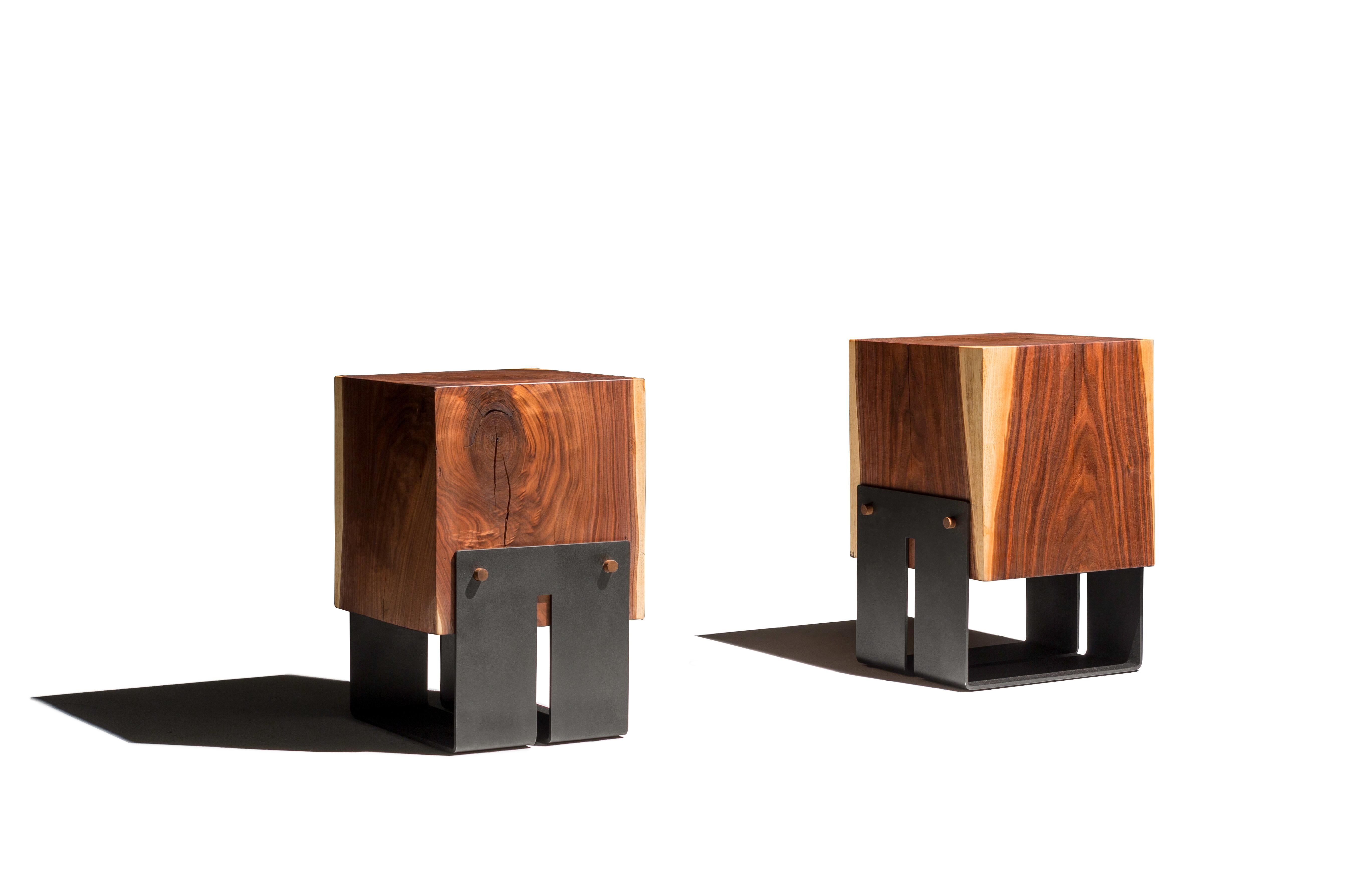 The Briggs side table incorporates a modern industrial style to the natural beauty of a solid walnut block. With a blackened steel base connected by dowels, these side tables are both structurally and aesthetically superior. This item can also be