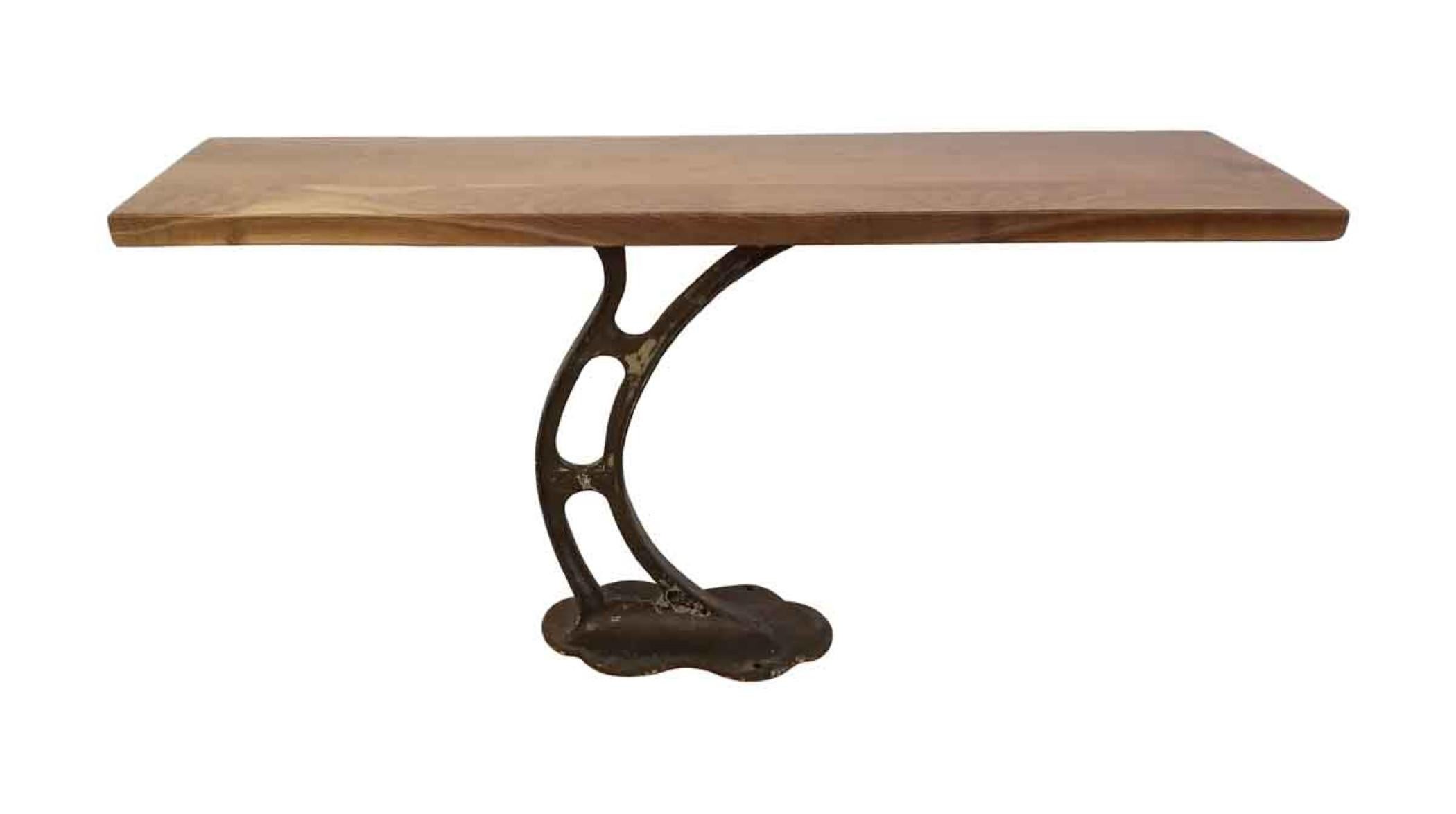 1920s industrial era cast iron base with a new solid black walnut top. Can be used as a console or side table.
