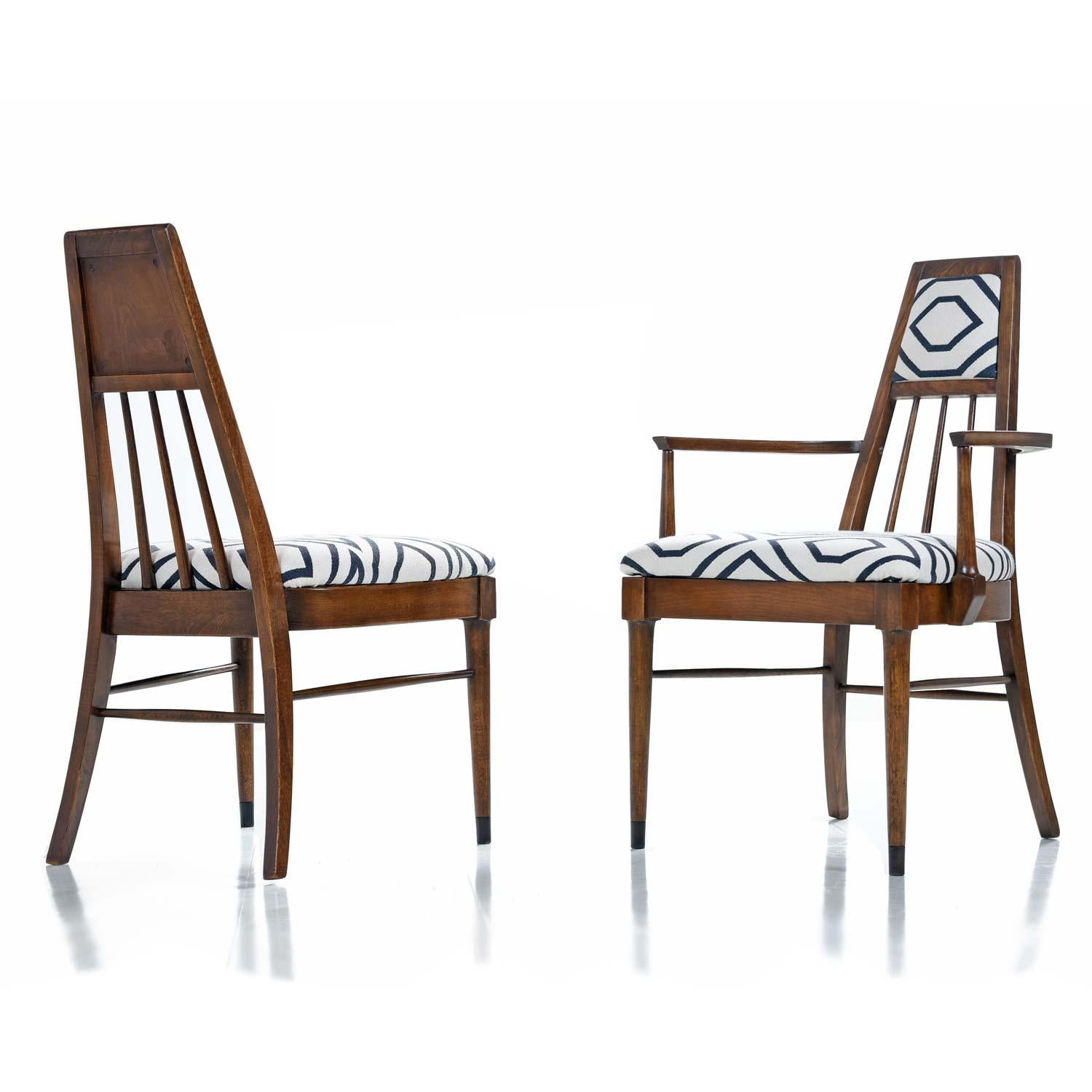 Set of four Mid-Century Modern dining chairs vintage, 1960s. These distinctive chairs are unlike any others we’ve seen before. The upholstered crown is absolutely novel and utterly unique. The solid walnut chairs have been fully restored. The set