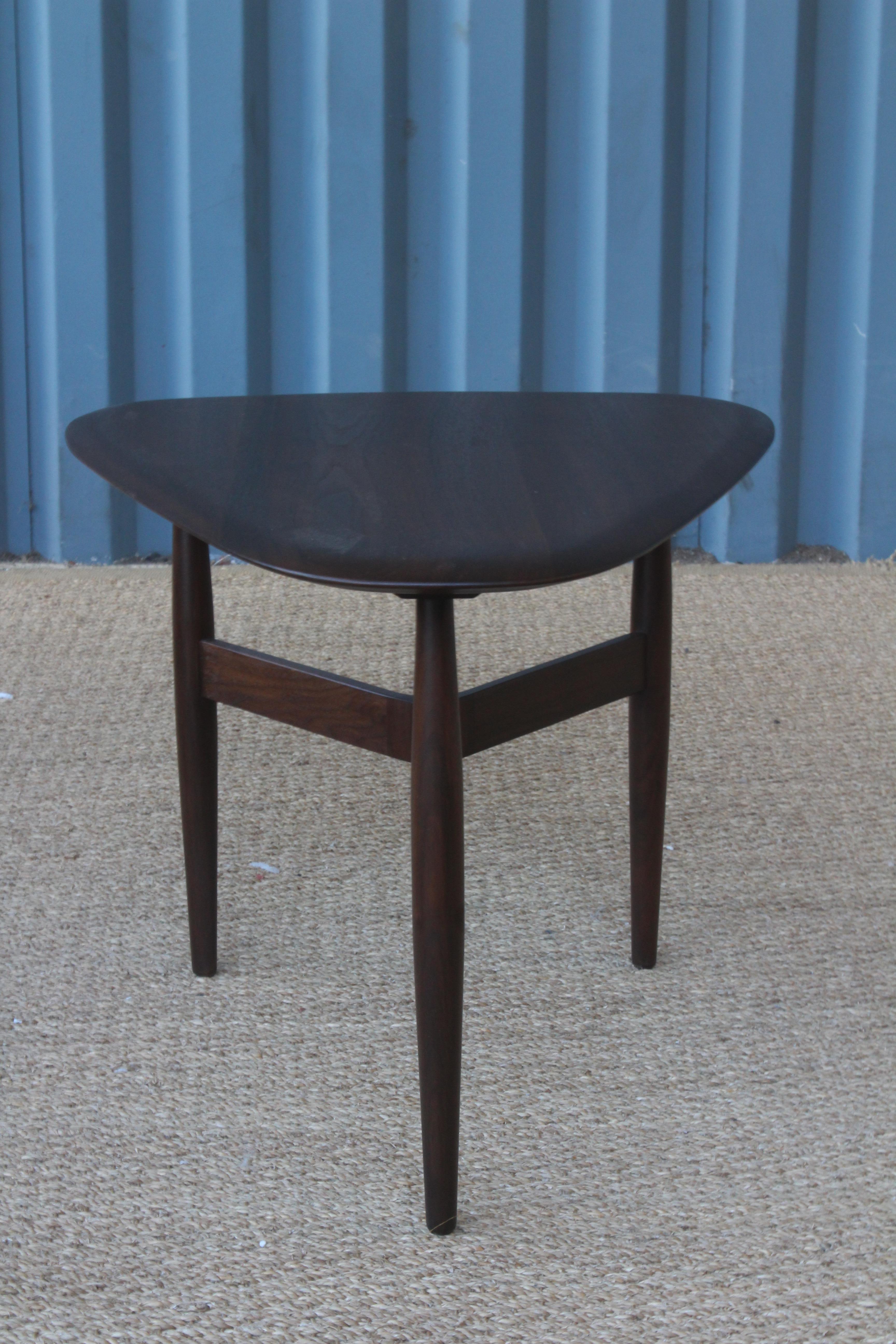 Solid walnut side table designed by John Keal for Brown Saltman in the 1950s. Recently refinished and in wonderful condition.