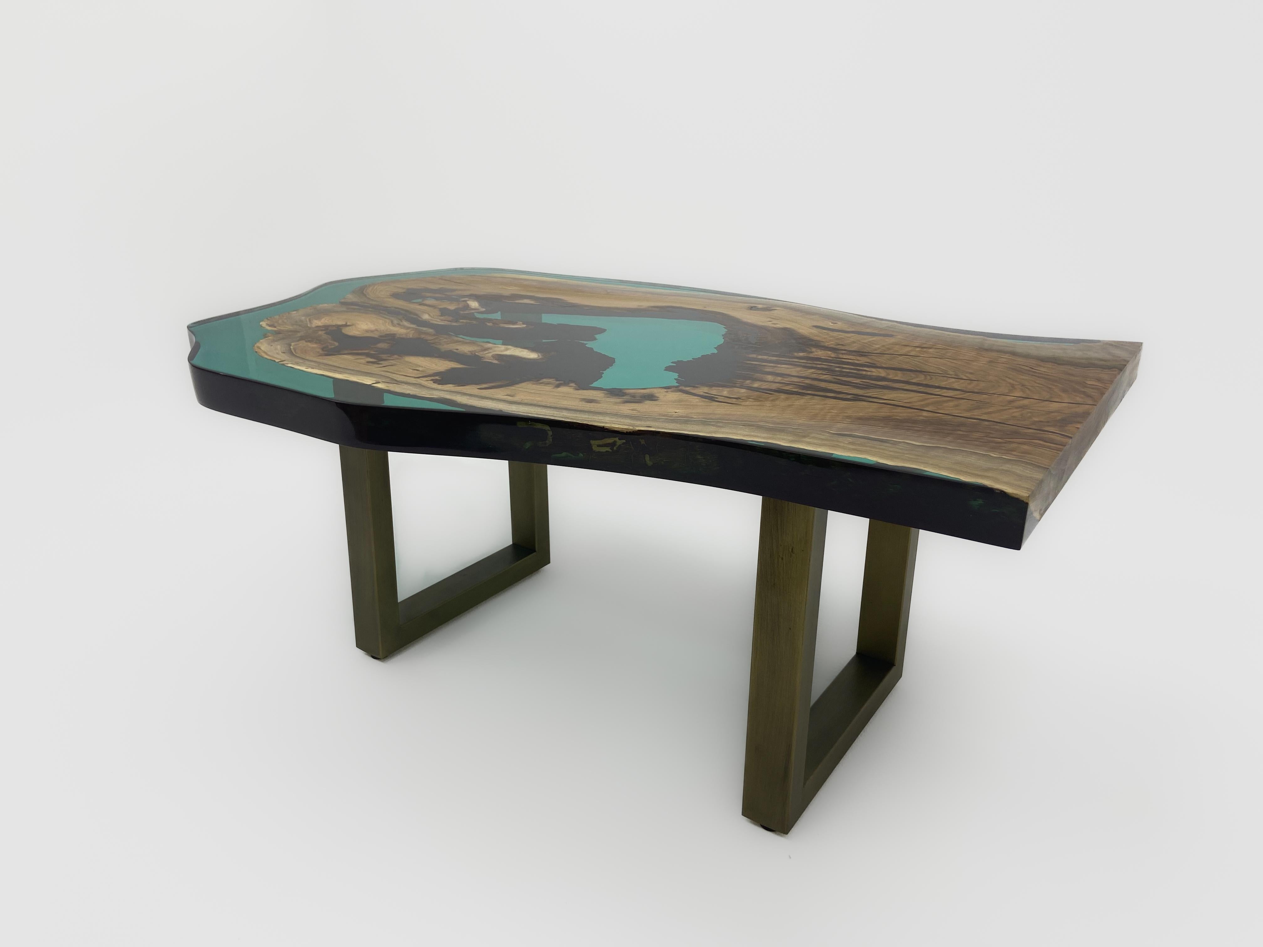 Turquoise Walnut Epoxy Coffee Table

Handcrafted by skilled artisans of Tinella Team, this coffee table seamlessly fuses natural wood with smoke epoxy resin, creating a captivating piece that captures nature's beauty. 
Its exceptional design and