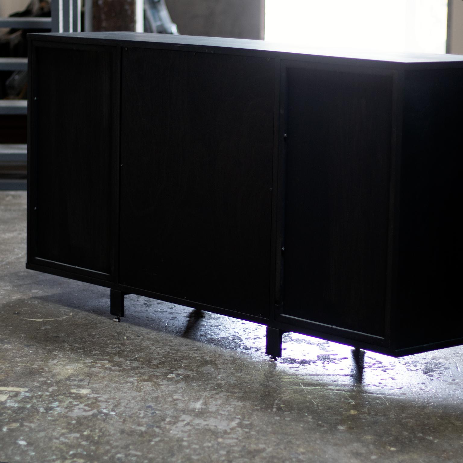 This cabinet is constructed of solid black walnut wood. The finish is India ink which provides a deep black colour while retaining the quality of the wood grain. 
Interior is customizable - shown here with three drawers.
  