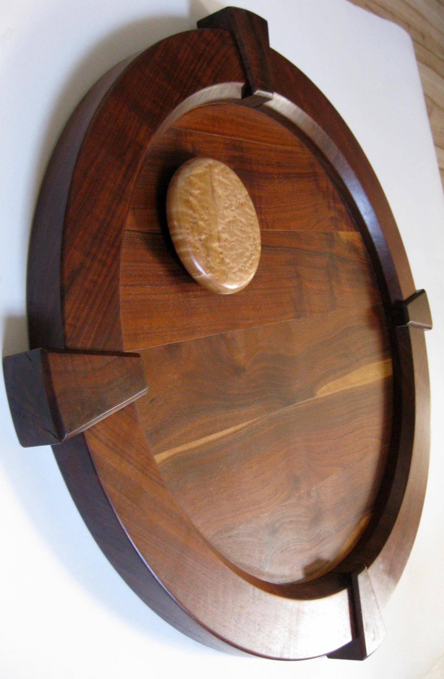 Made of solid walnut and bird's-eye maple wood, this large wall hanging is by Southern California artists Jerry & Jan Coker. Signed 