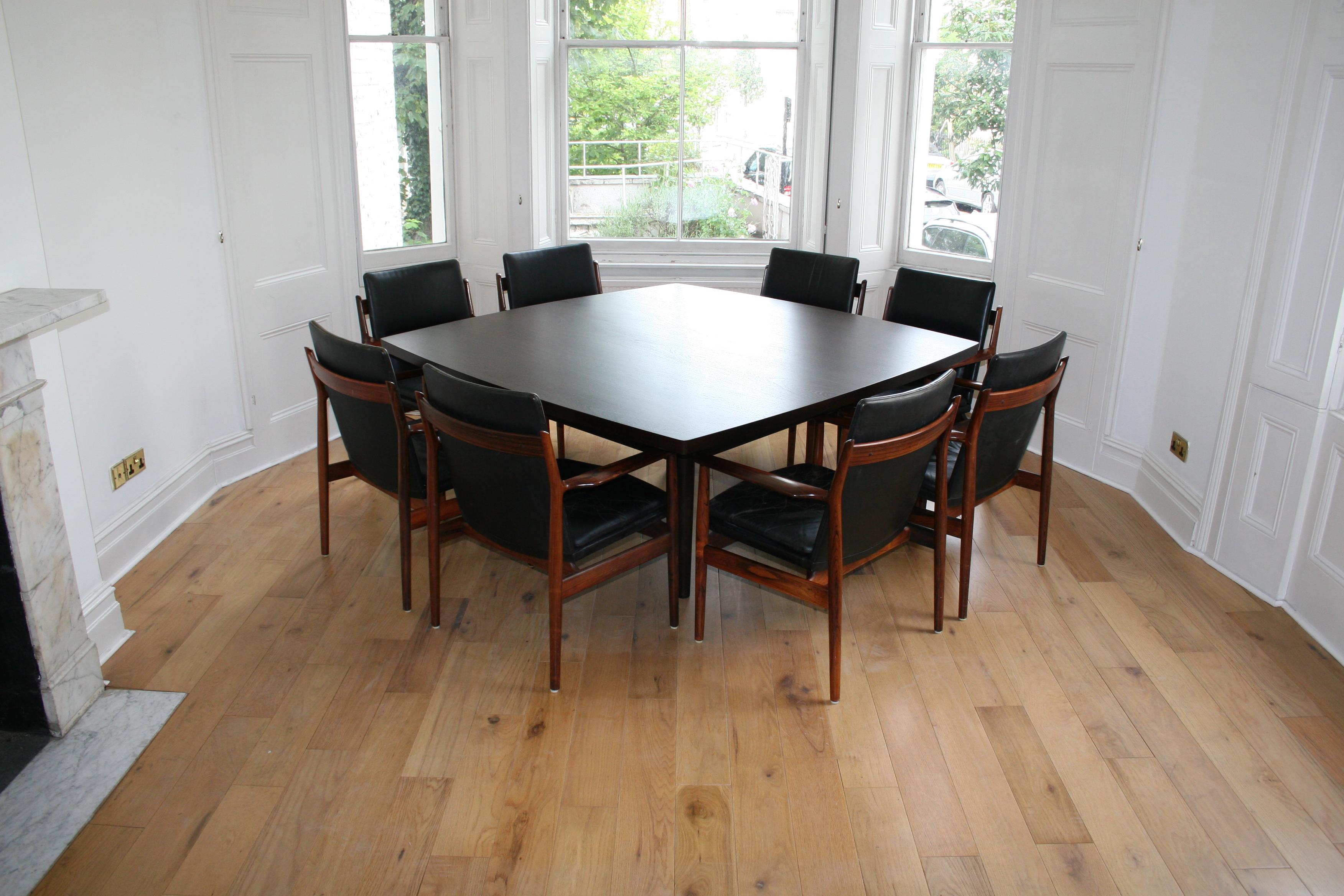 Made in Denmark about 2010 for a customer who has now downsized, the solid wenge top is made of 3 slabs of wenge sawn to make three pairs  of booked matched boards either side of the square top. Furthermore, the edges of the table show the ends of
