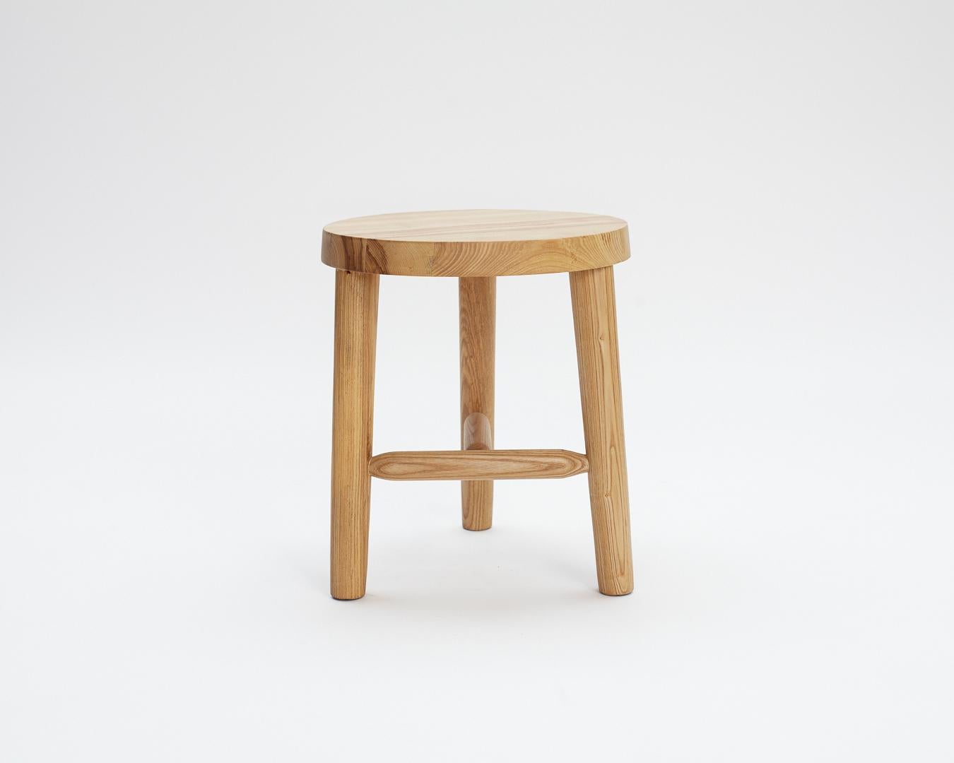 Inspired by a milking stool, our three legged 16” stool sits low to the ground and is made from solid ash. Cross braces add sturdiness and beautiful detailing.
