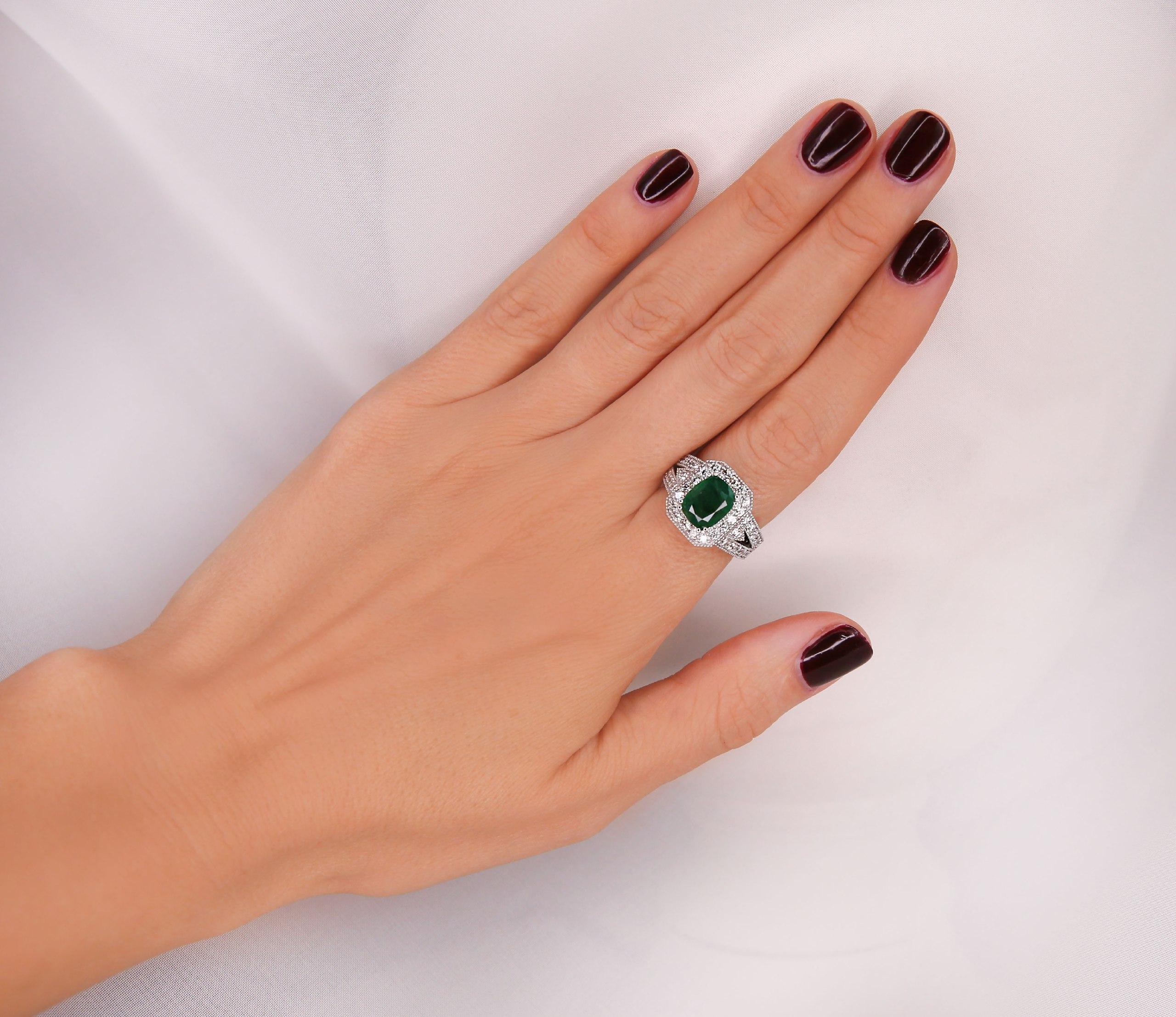 Ring White Gold 18 K 
Material: 18K White Gold 

Mainstone: Natural Emerald
 2.17 Carat 

Stone Shape: Oval 
Dimensions: 9.14x7.32 mm 
Treatment Method: Oil

Natural  Diamond

Color: F-G 
Clarity: VS2-SI1 
1.00 Carat Round 
Not-treated 
Total All