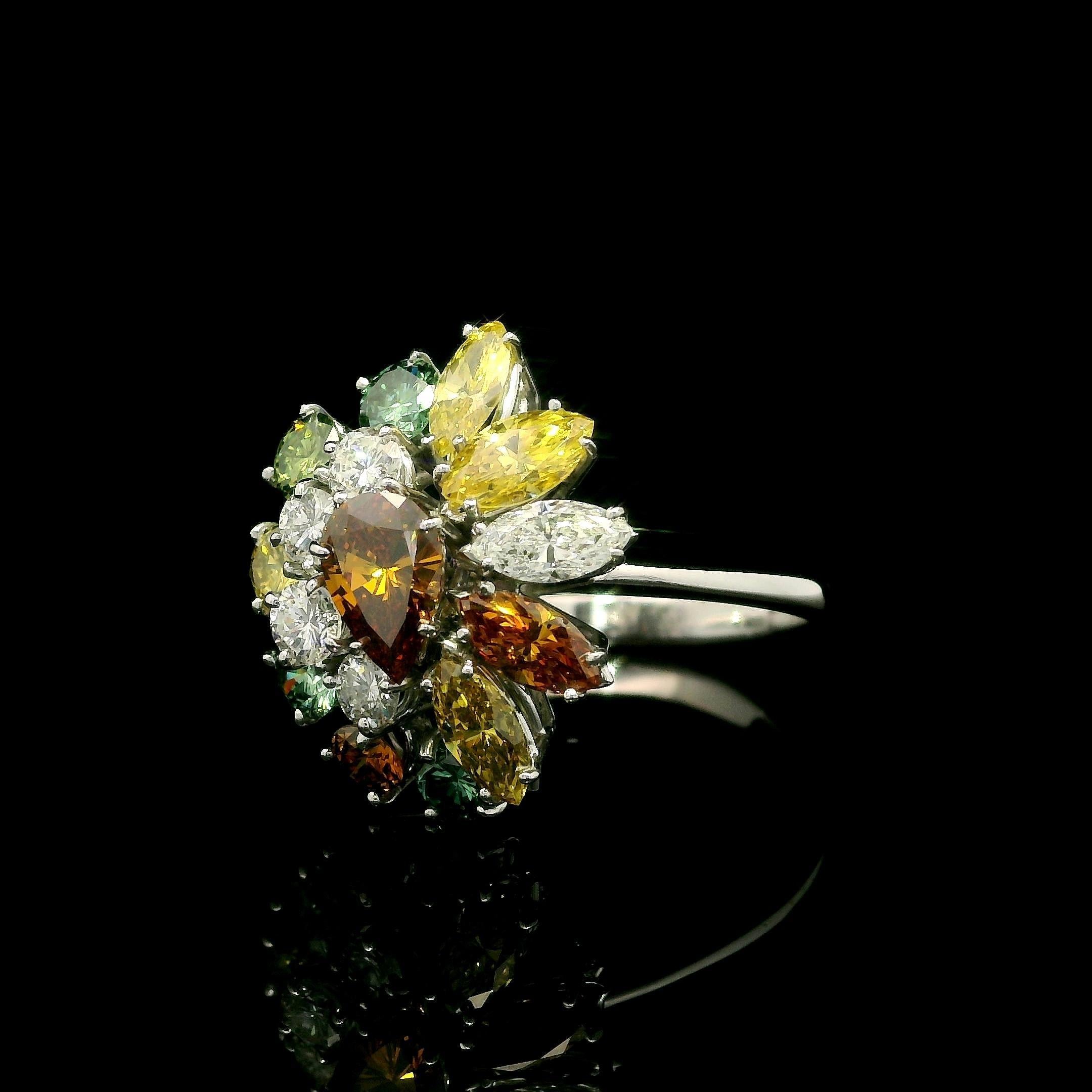 --Stone(s):--
(16) Natural Genuine Diamonds - Round. Pear & Marquise Cut - Prong Set - White & Colored Color - Colored Diamonds Are Treated - 3.08ctw (approx.)

Material: Solid 18k White Gold
Weight: 5.7 Grams
Ring Size: 7.0 (Fitted on a finger. We