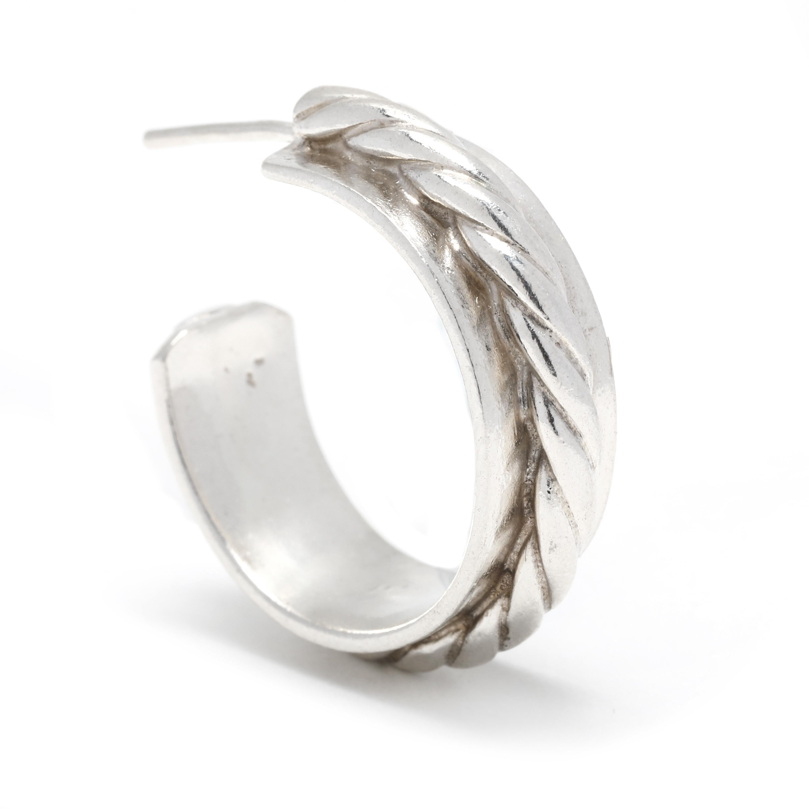 These beautiful sterling silver hoop earrings are the perfect addition to any outfit. Crafted with a solid wide rope twist detail, the vintage silver hoops have a classic look that will never go out of style. Measuring 1 inch in length, the post