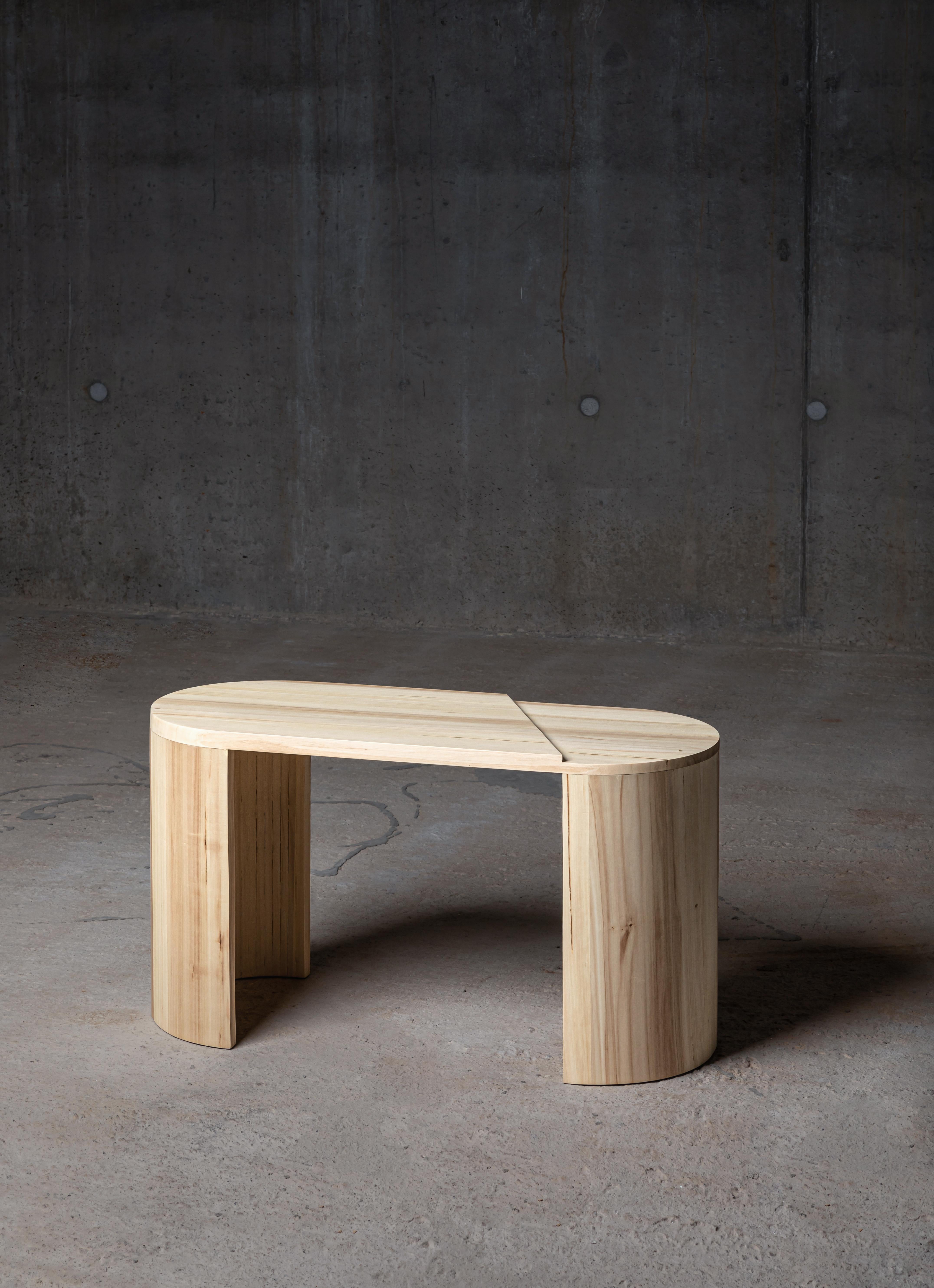A generous sized coffee table made from tulip wood, and the makers marks are visible in the kerf bend on the legs. The soft shape is a nod to the materials former life, but the graphic line cutting through it - creating a step in the top - reminds