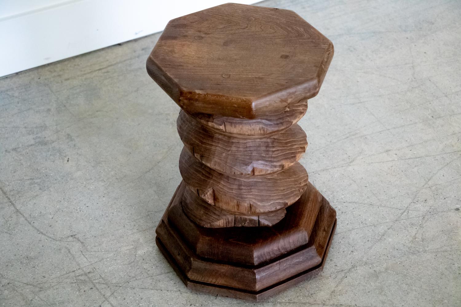 Solid and heavy twisted wood stool from France. Original dark wood finish. Perfect as a stool or table.