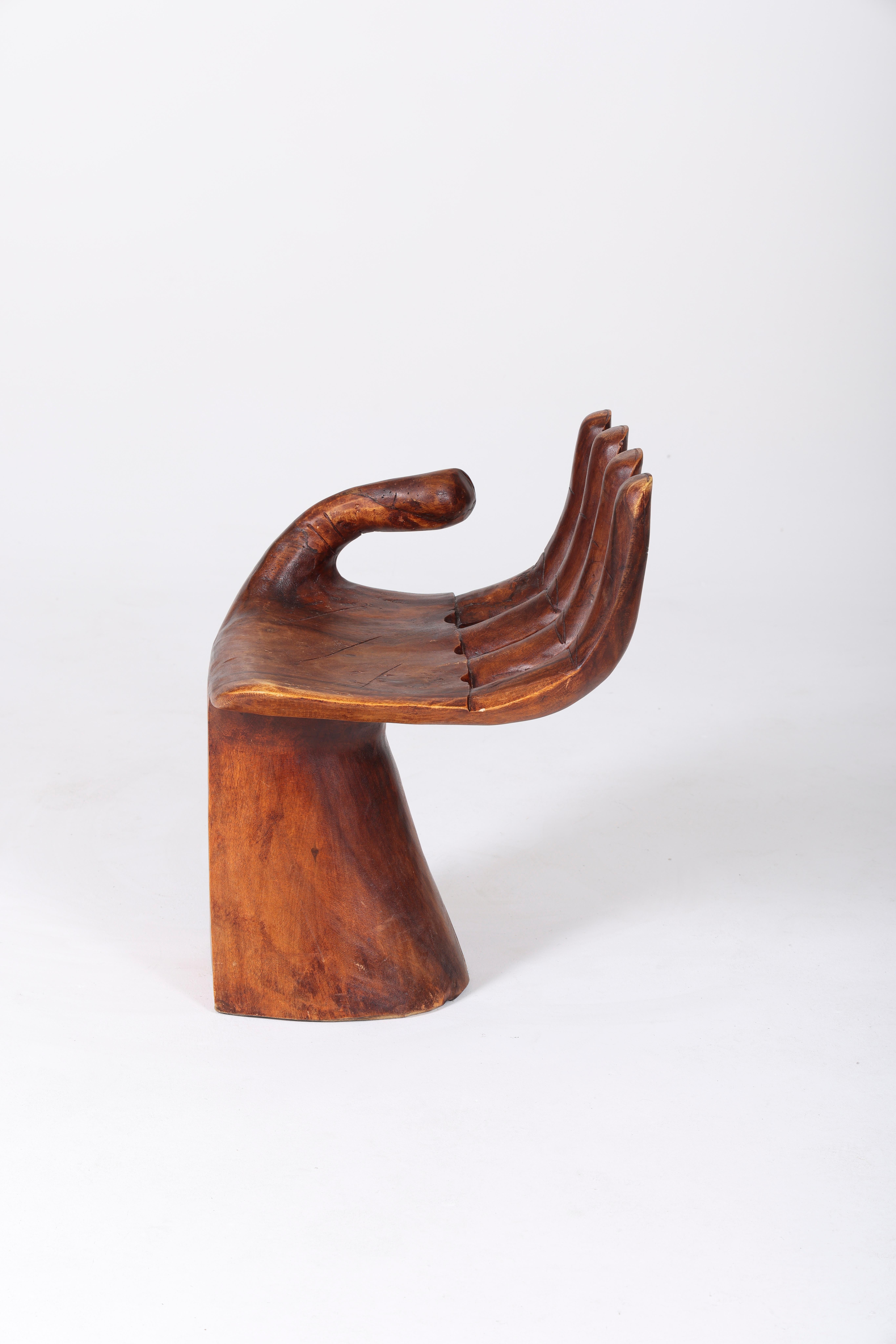 wooden hand shaped chair
